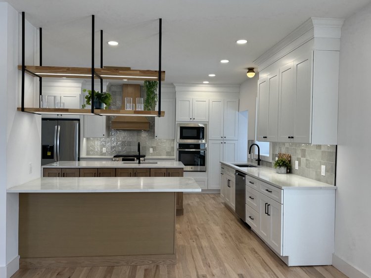 Merrison Street open kitchen with a large island and wood range hood