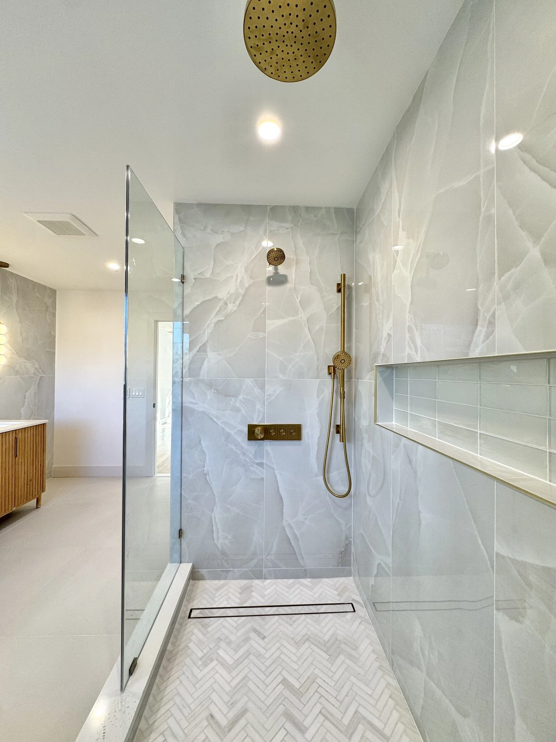 woodland-road-14-primary-bath-marble-shower-herringbone-pan.jpg