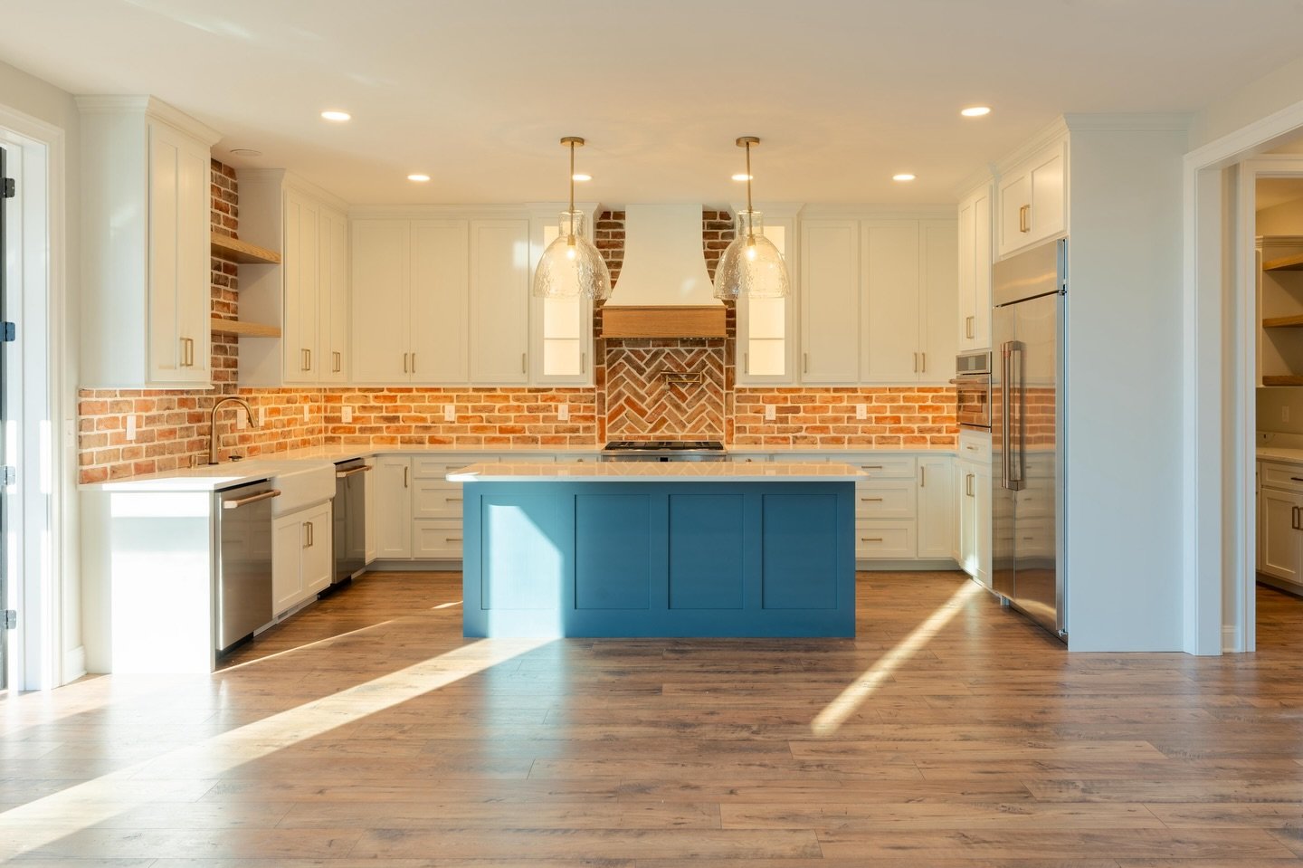 Imagine designing a kitchen that feels this warm, timeless, and inviting. The brick, the textures, the thoughtful details&mdash;this space is a beautiful reflection of intentional custom design. 

Do you have a dream kitchen in mind? We&rsquo;d love 