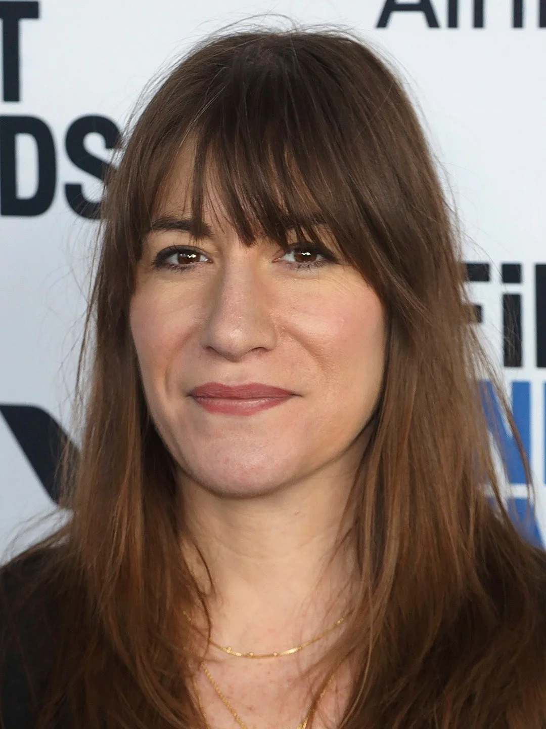 Mollye Asher, film producer, at a step and repeat