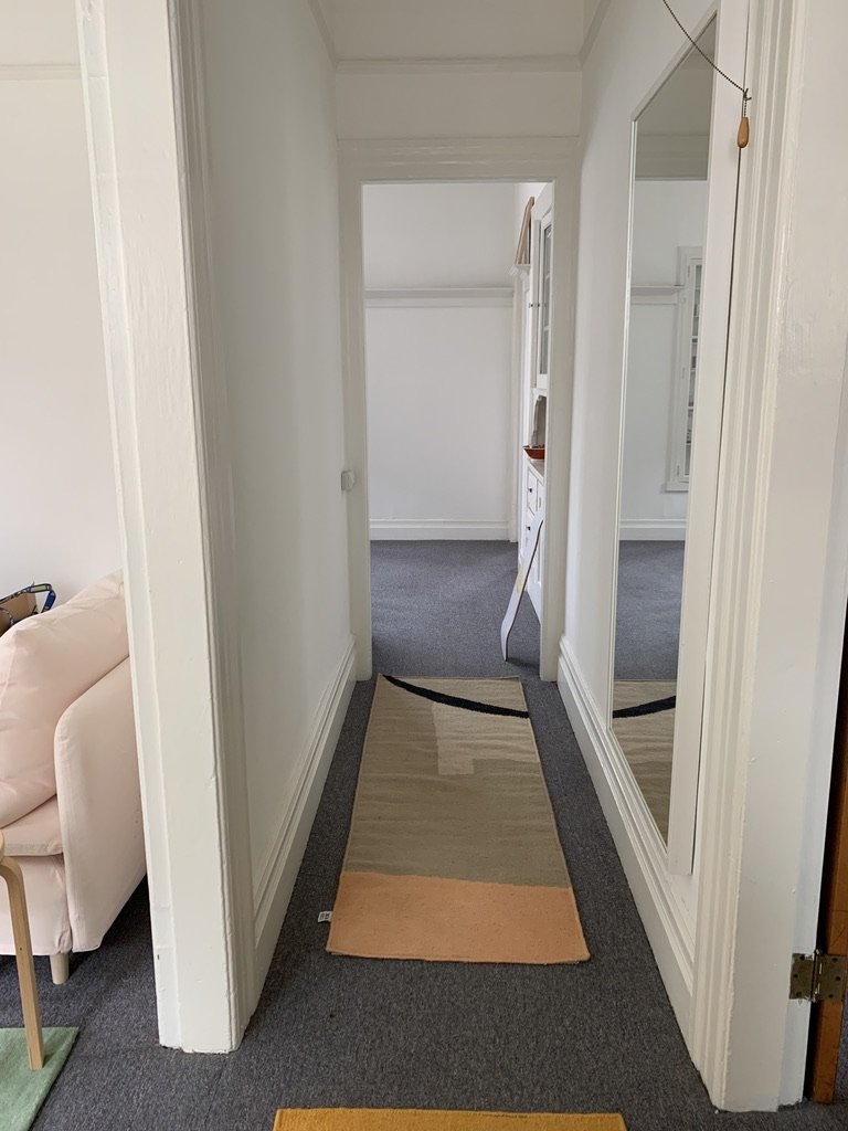 Hallway right when you enter -- living room to the right, bedroom to the left, dining room straight down