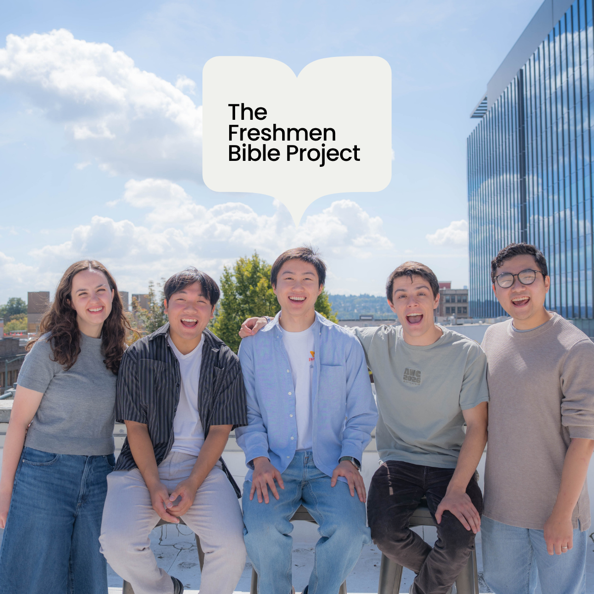 Group of five diverse young people standing outdoors on a rooftop, smiling, with a large speech bubble above them that says "The Freshmen Bible Project."