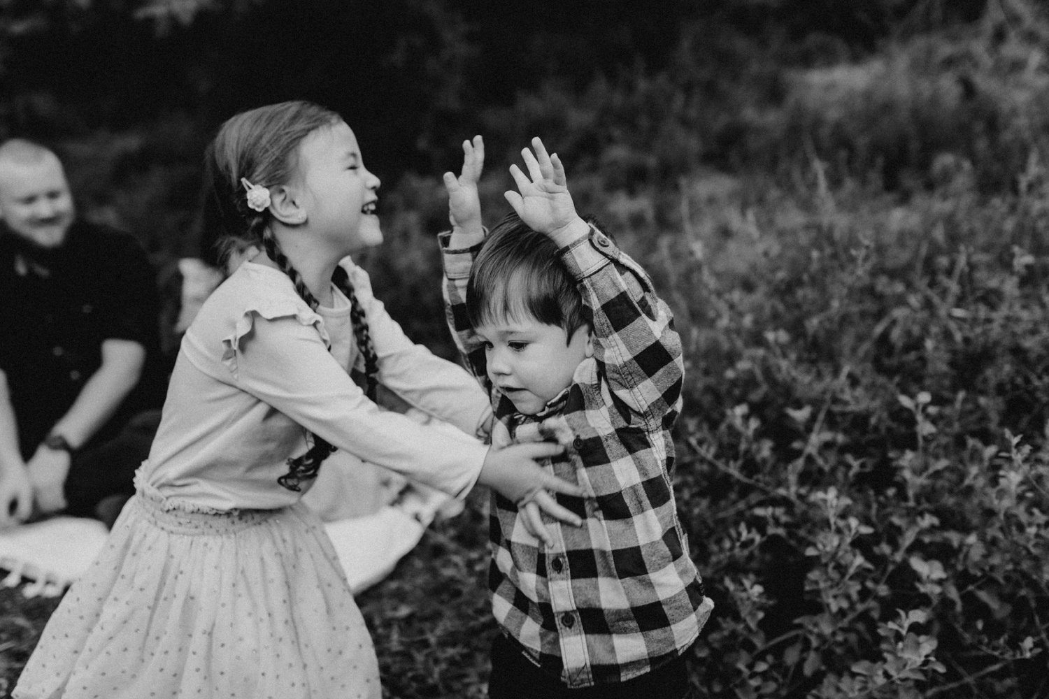 07_DTEV-19_black and white photo of two siblings dancing together in a bush setting. .jpg