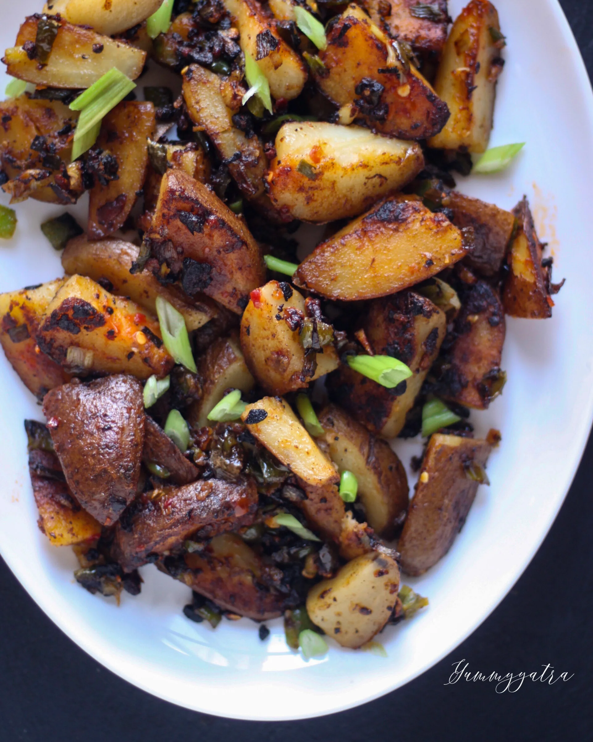 Crispy oven roasted potatoes with crispy garlic