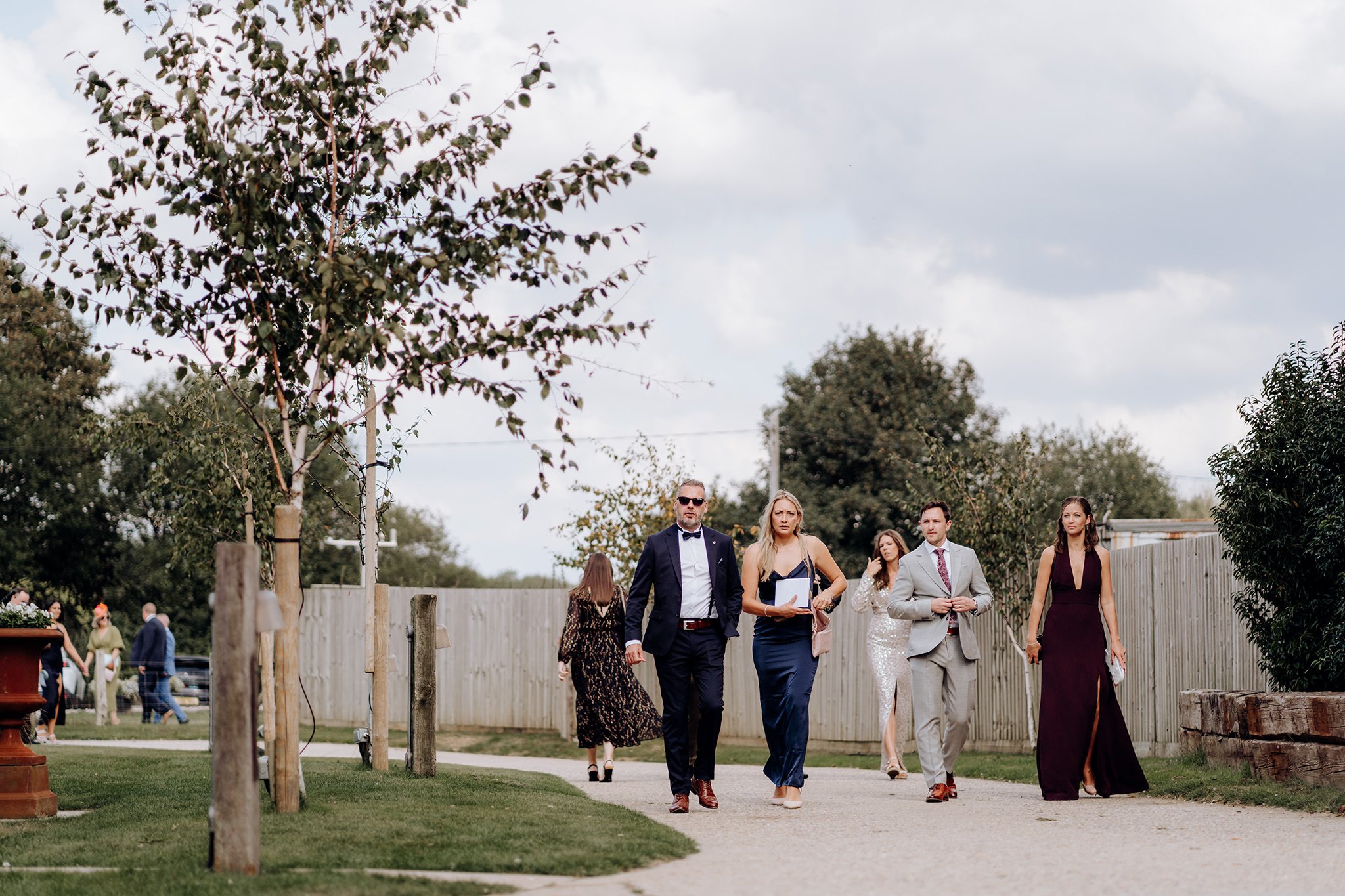 Guests making their way to the wedding reception at The Barn at Botley Hill