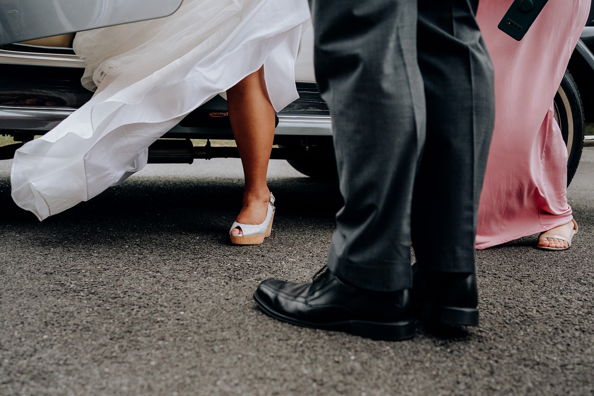 Bride stepping out of the car