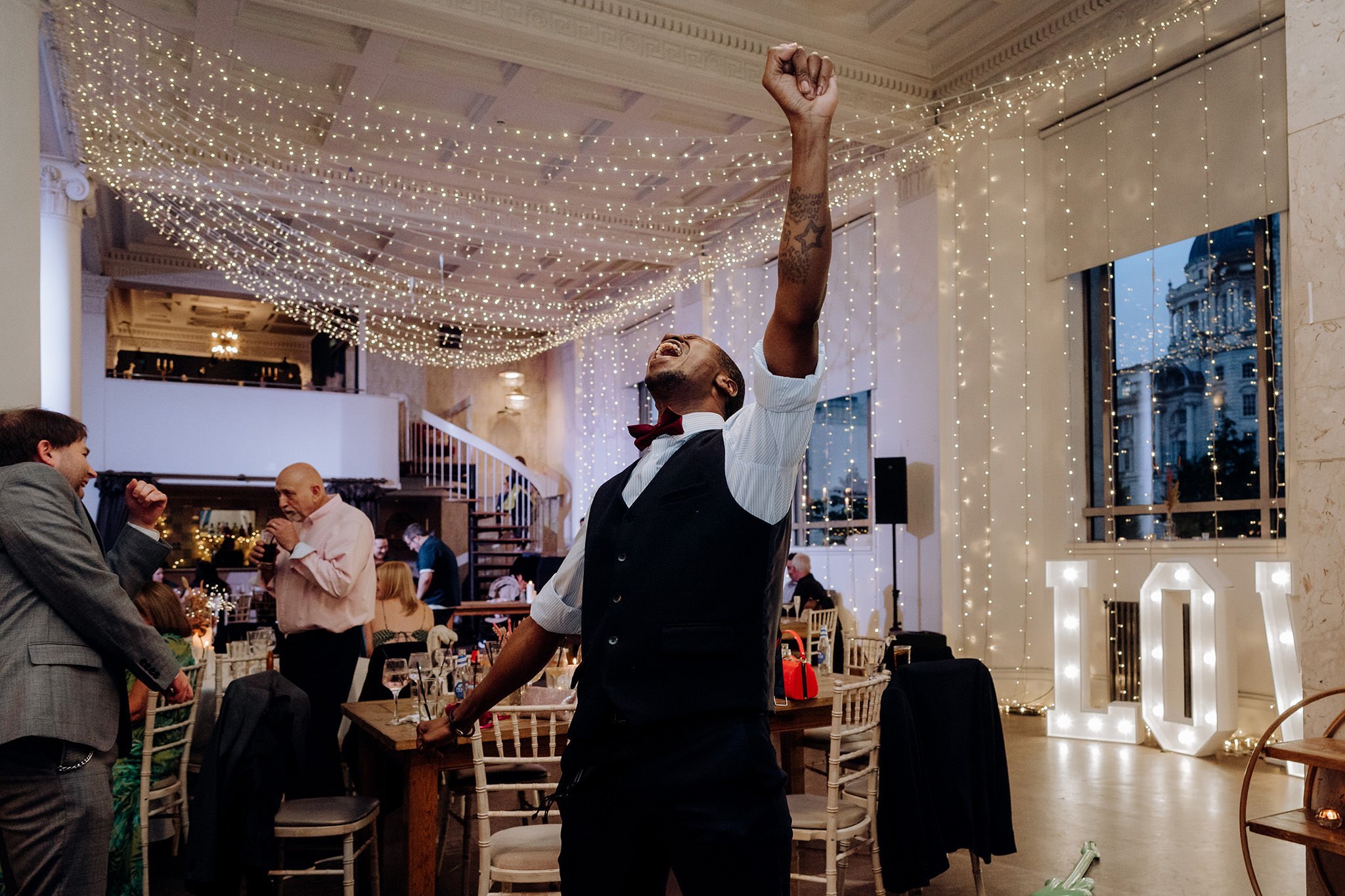 Happy wedding guest dancing at Oh Me Oh My, Liverpool