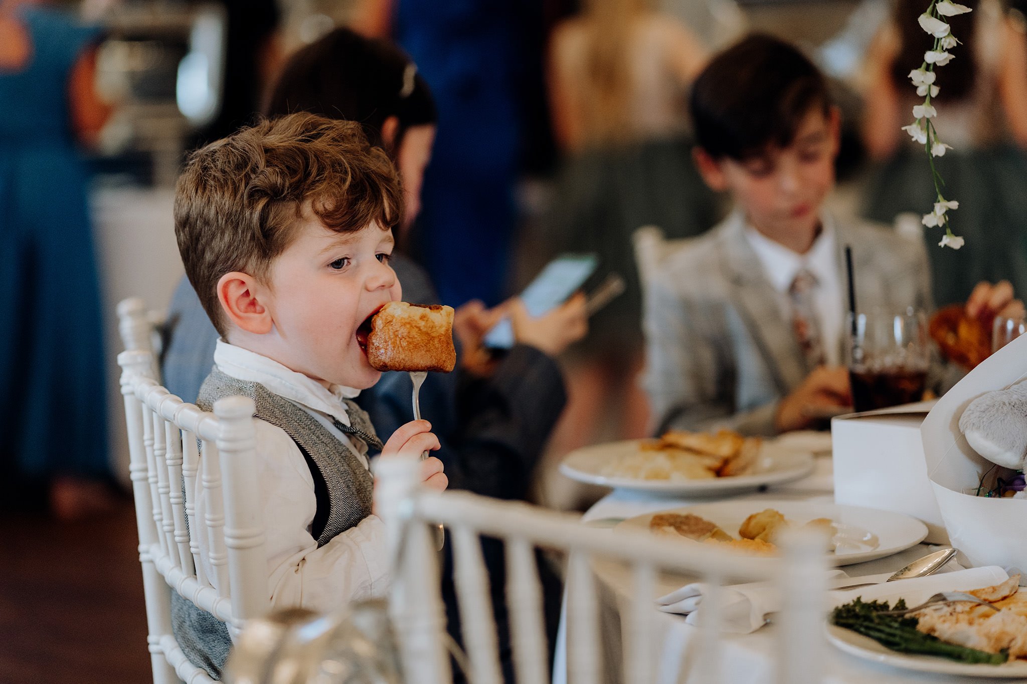 Young guest enjoying a Yorkshire Pudding