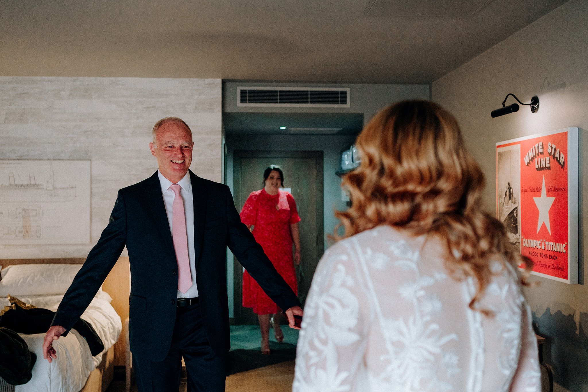 Father happy reaction to seeing his daughter in her wedding dress on the morning of her wedding