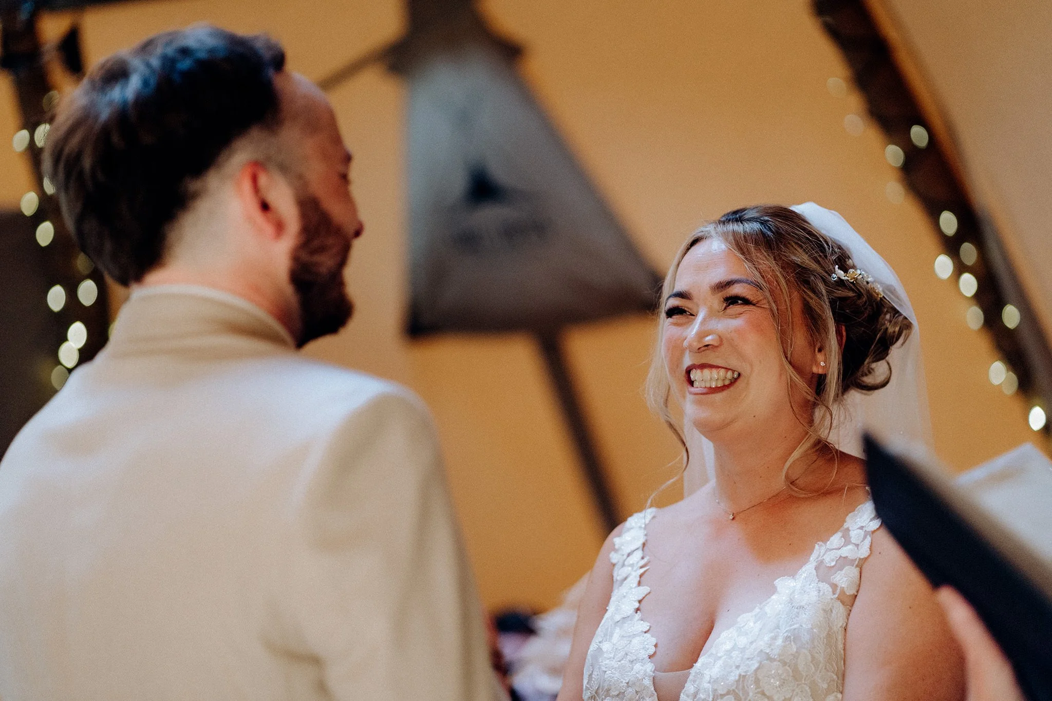 bride during indoor wedding ceremony at tipis at riley green