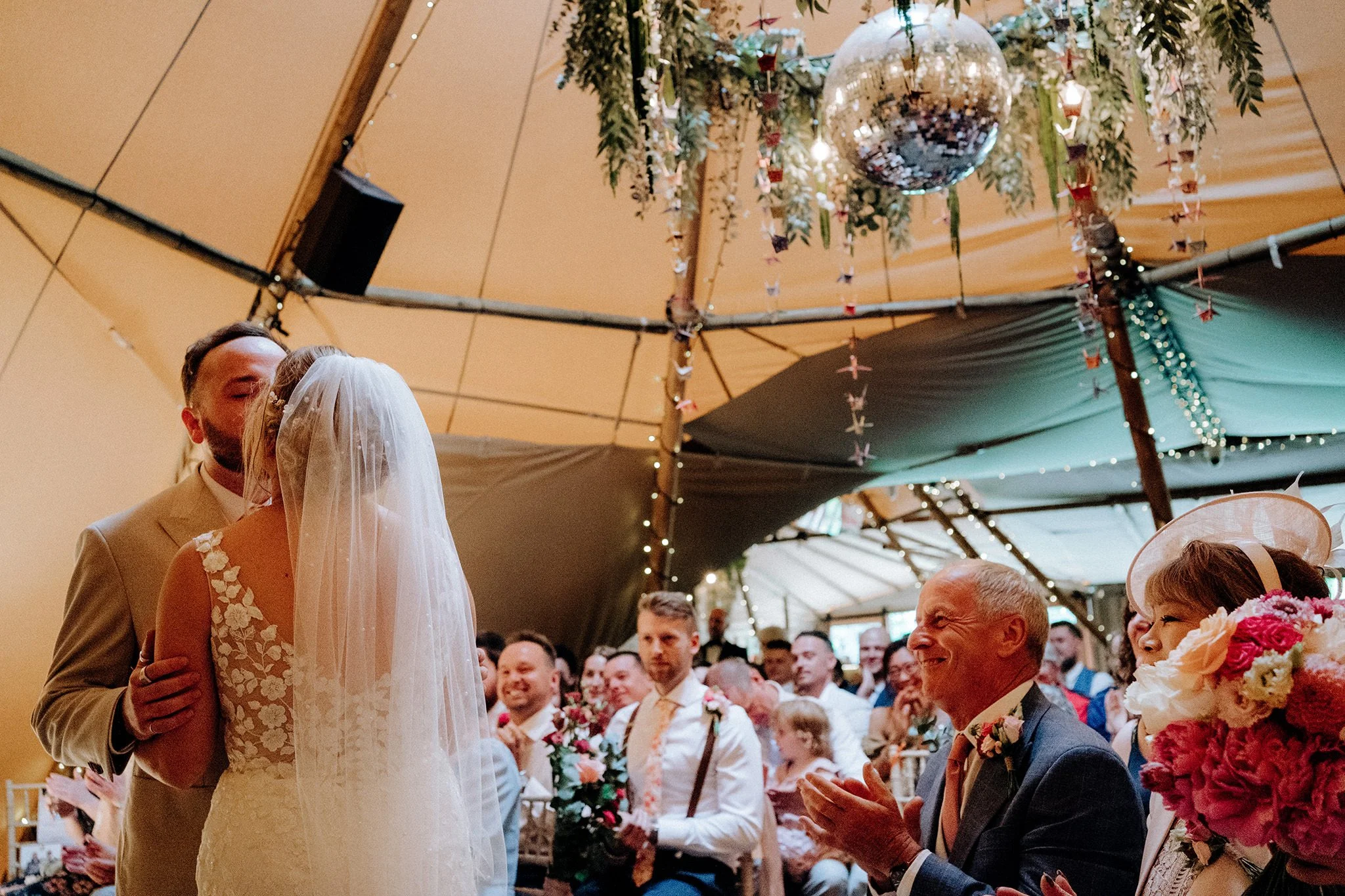 first kiss during wedding ceremony at tipis at riley green