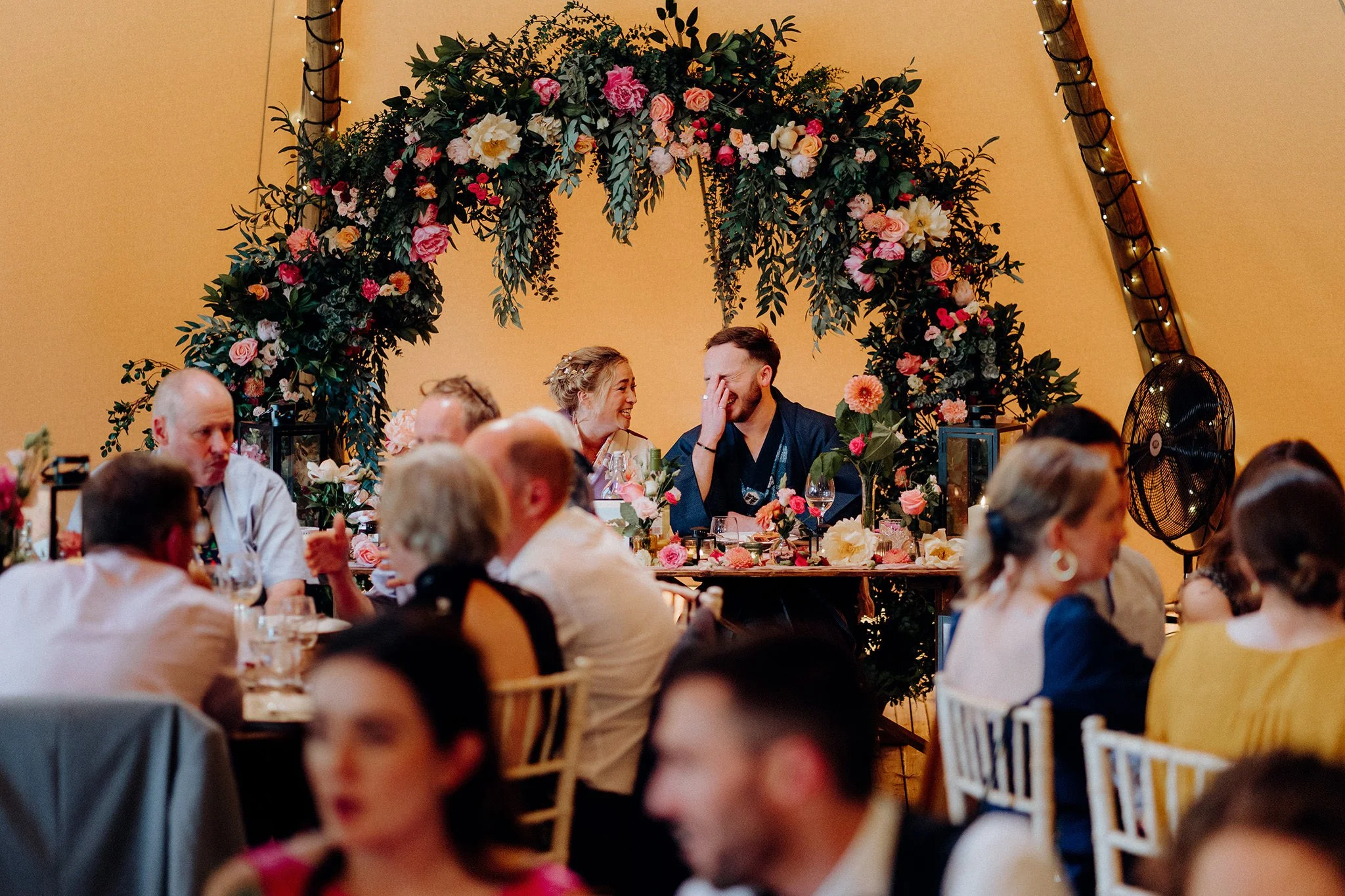 bride and groom share a funny moment, at tipis at riley green