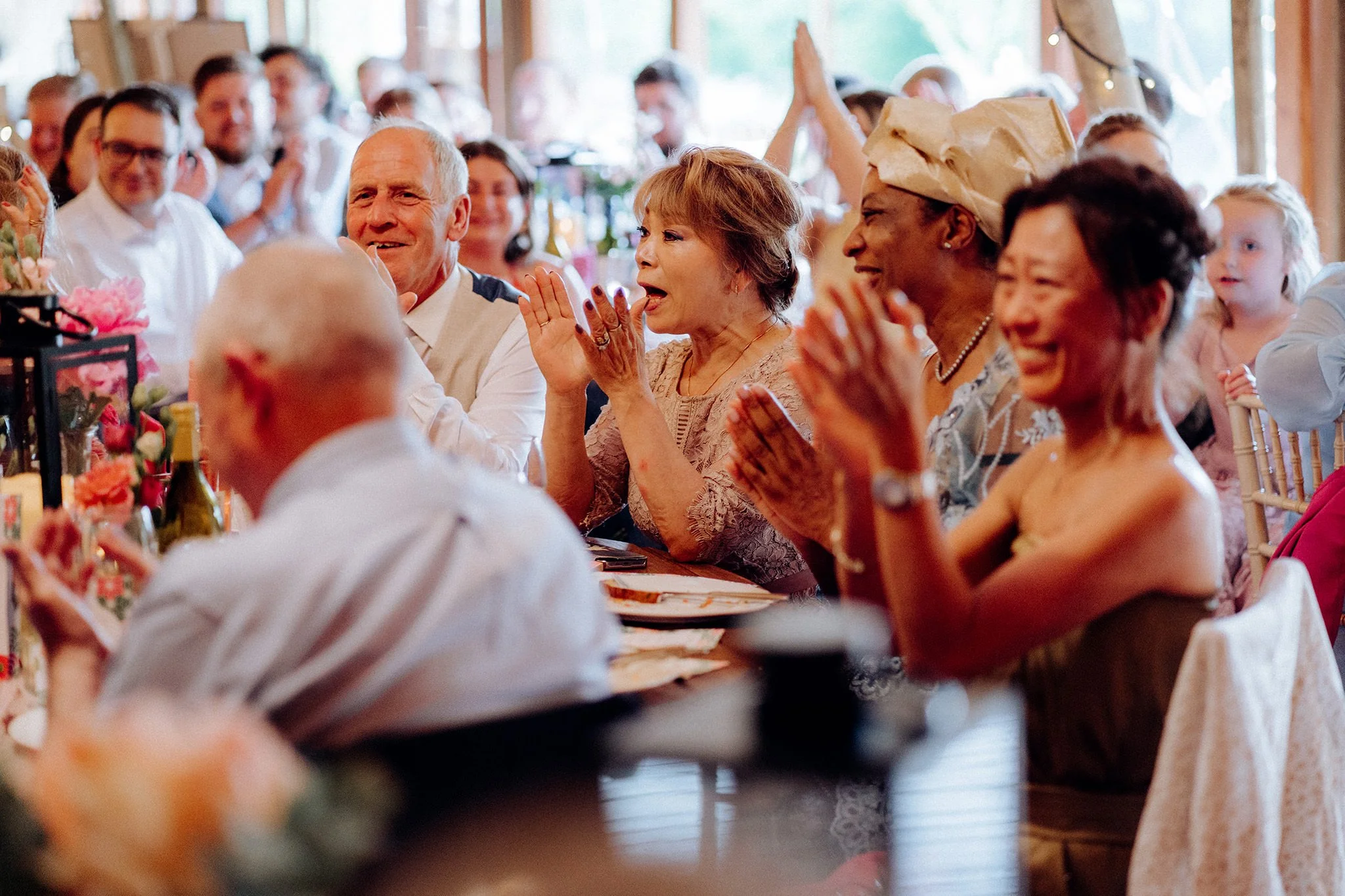 guests reacting to groom speech