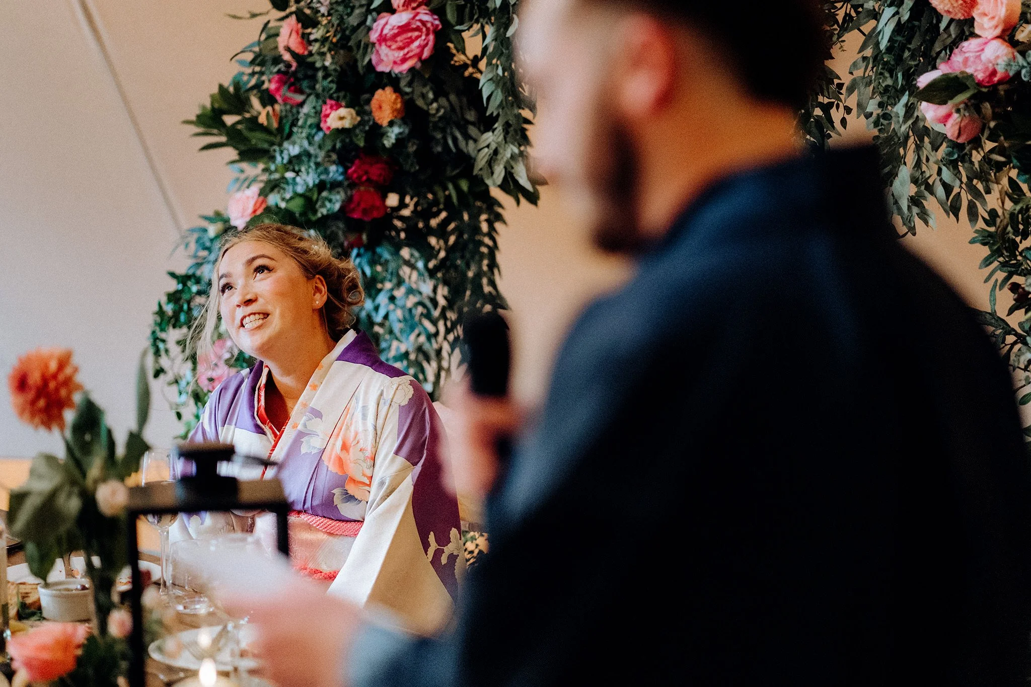 bride reacts to groom's speech at tipis at riley green