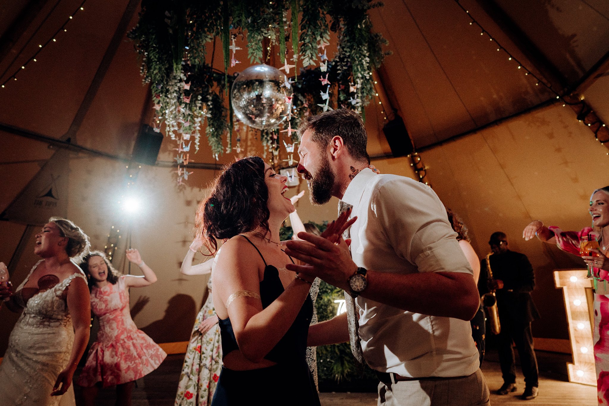 on the dancefloor at the tipis at riley green