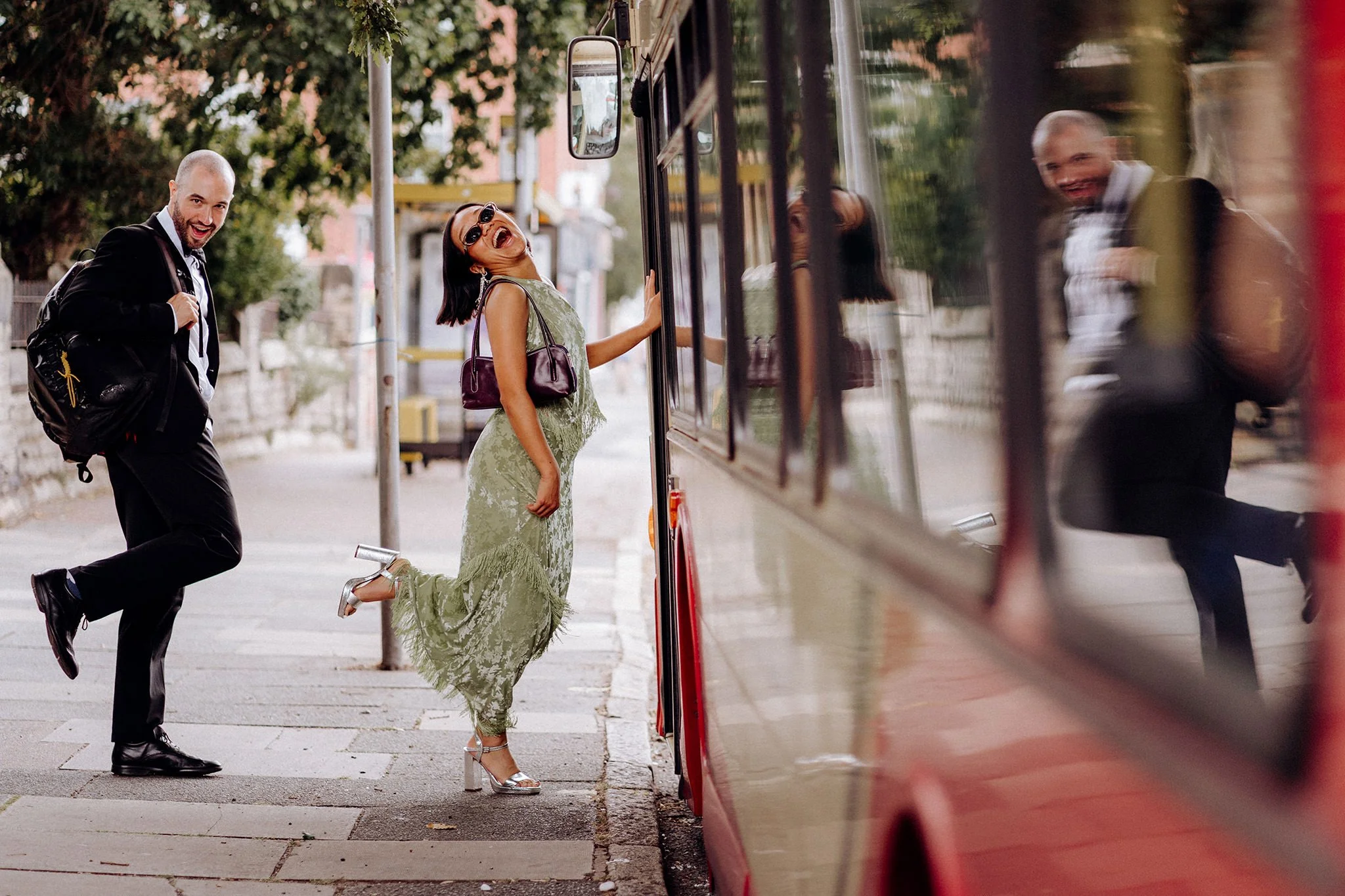 wedding guests getting on the bus