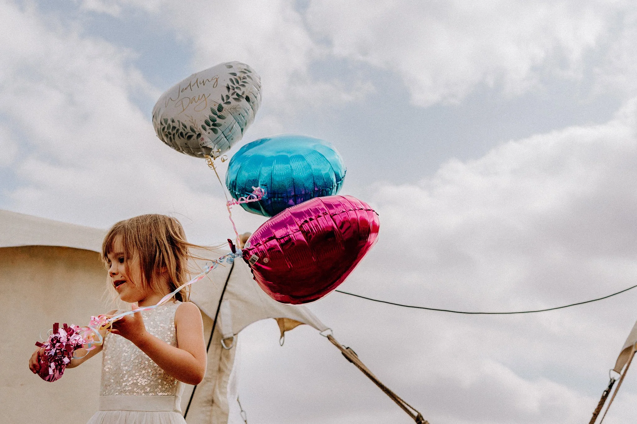 young wedding guest with ballons