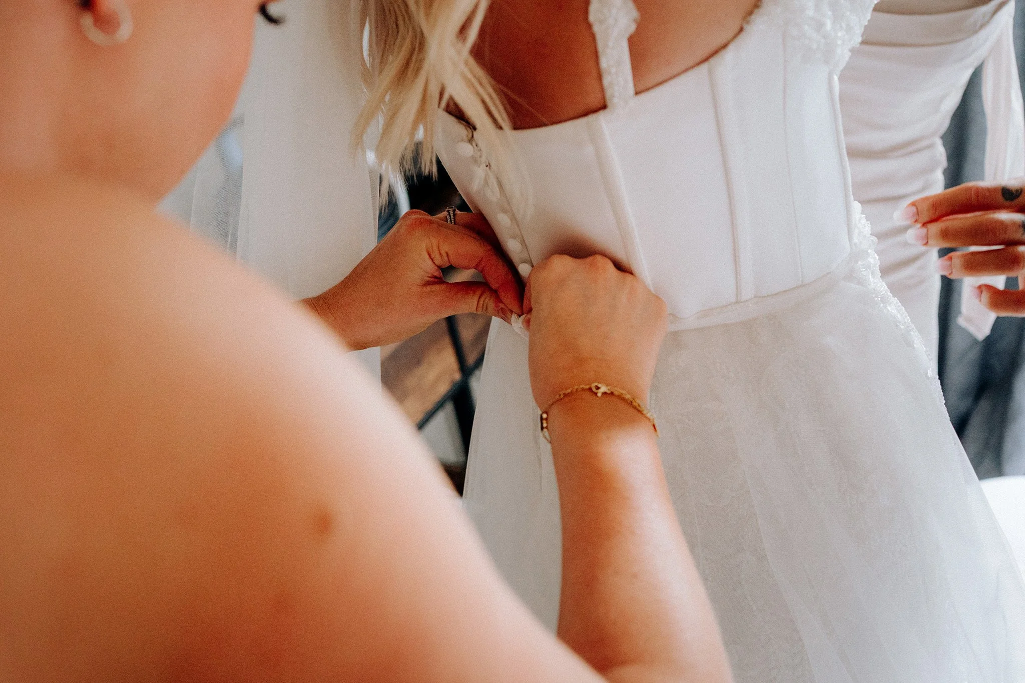 bride getting dress fitted in wallasey