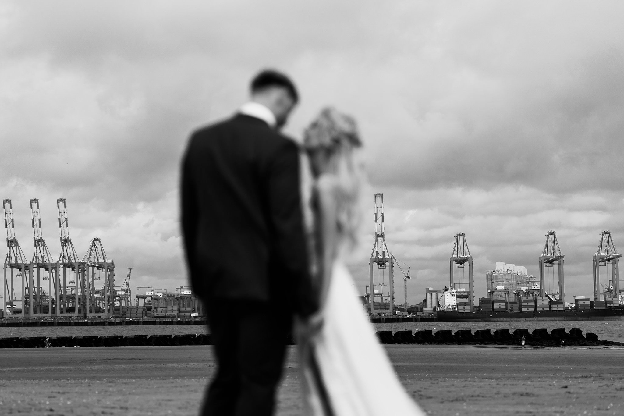 bride and groom photos at the beach wallasey
