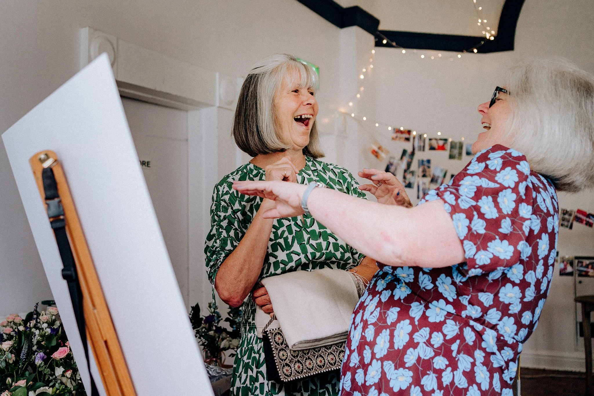 guests laughing at village hall wedding