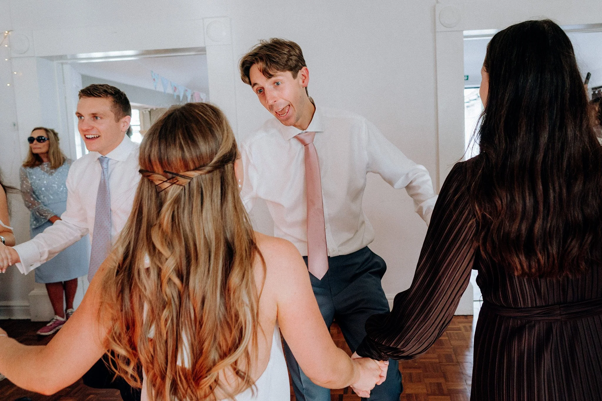 ceilidh fun at a village hall wedding 