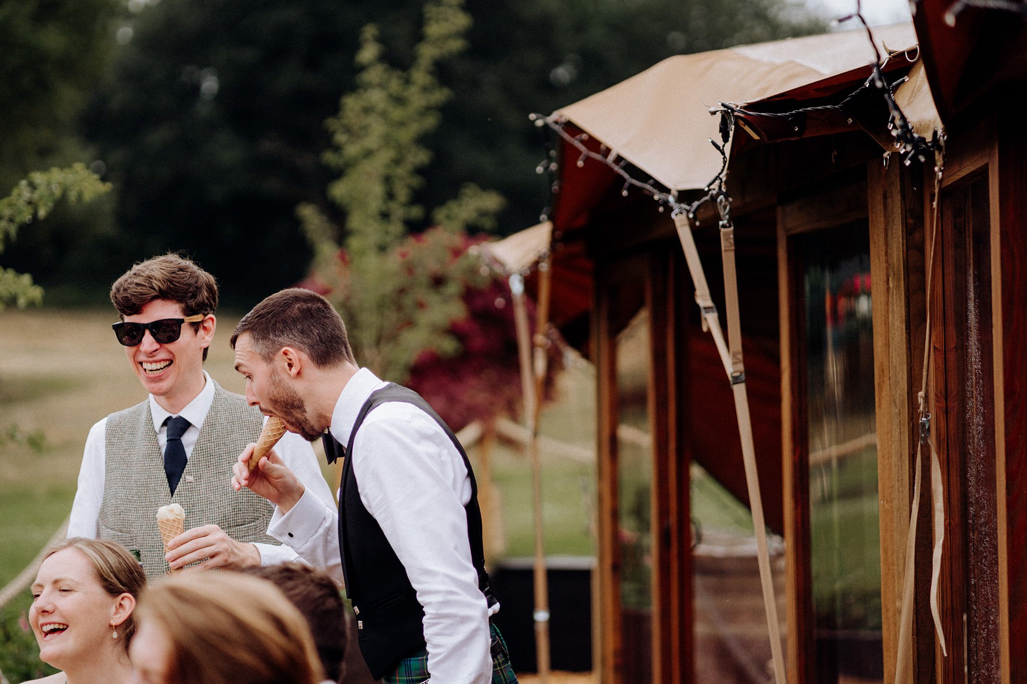 wedding guests eating ice cream at tipis at riley green