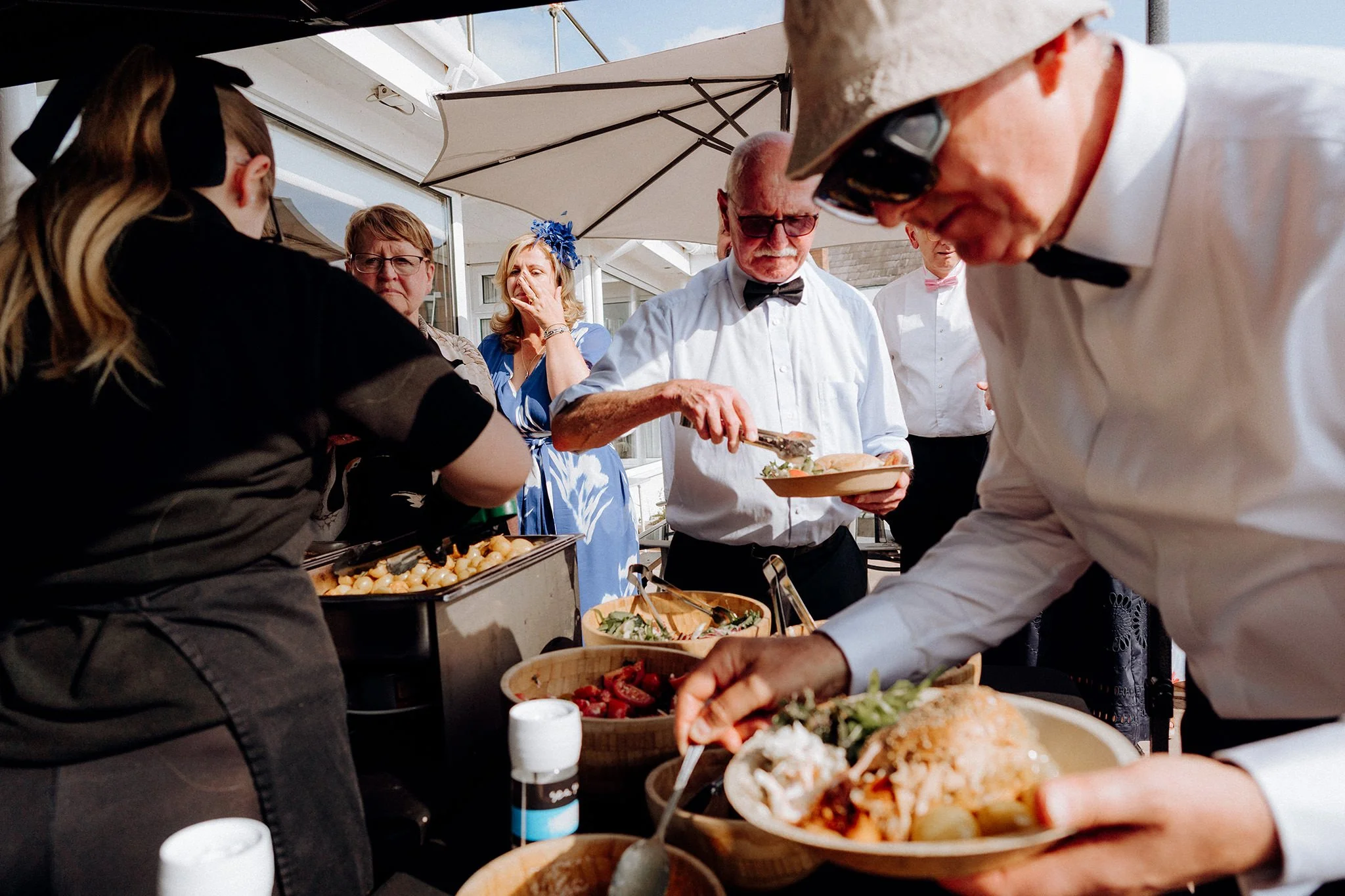 wedding guests getting their dinner