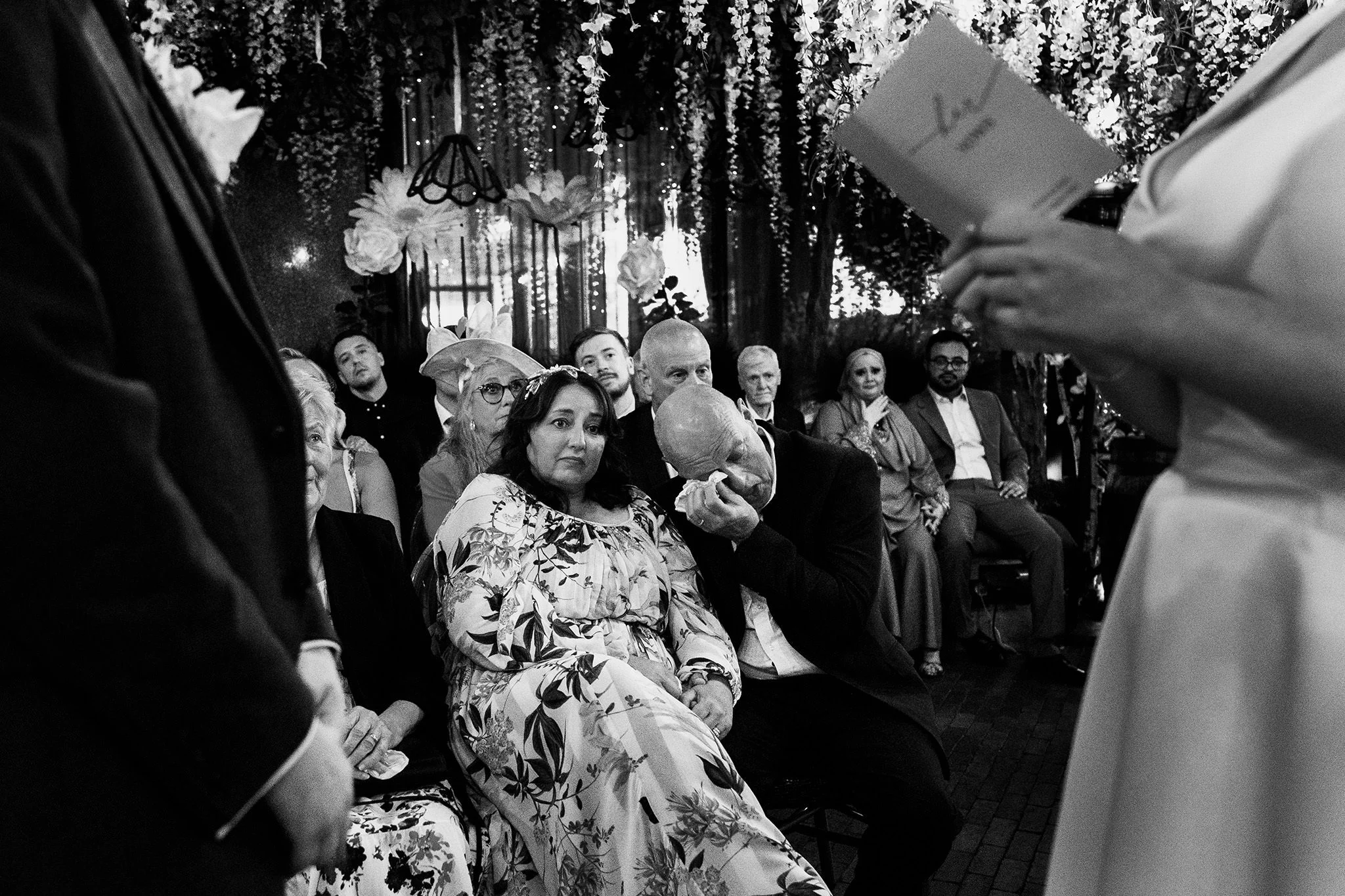 emotional guests look on during the vows at the black friar salford manchester