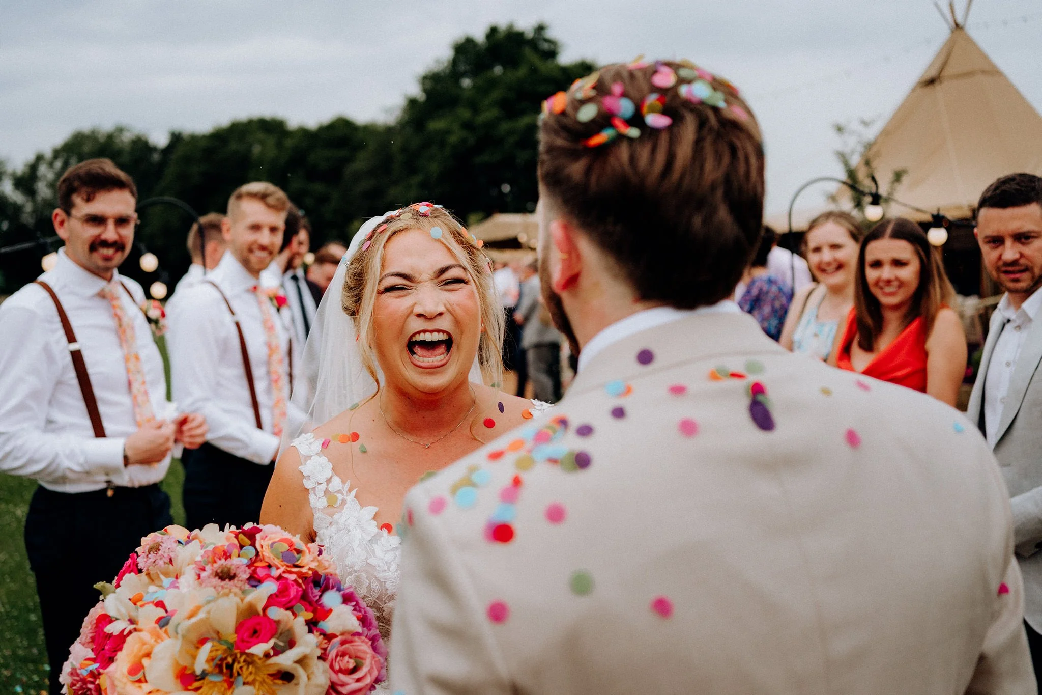 happy bride shortly after confetti at tipis at riley green