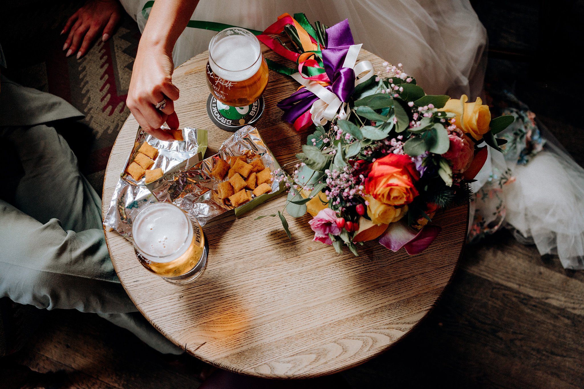 bride and groom have a pint at their favourite pub in liverpool