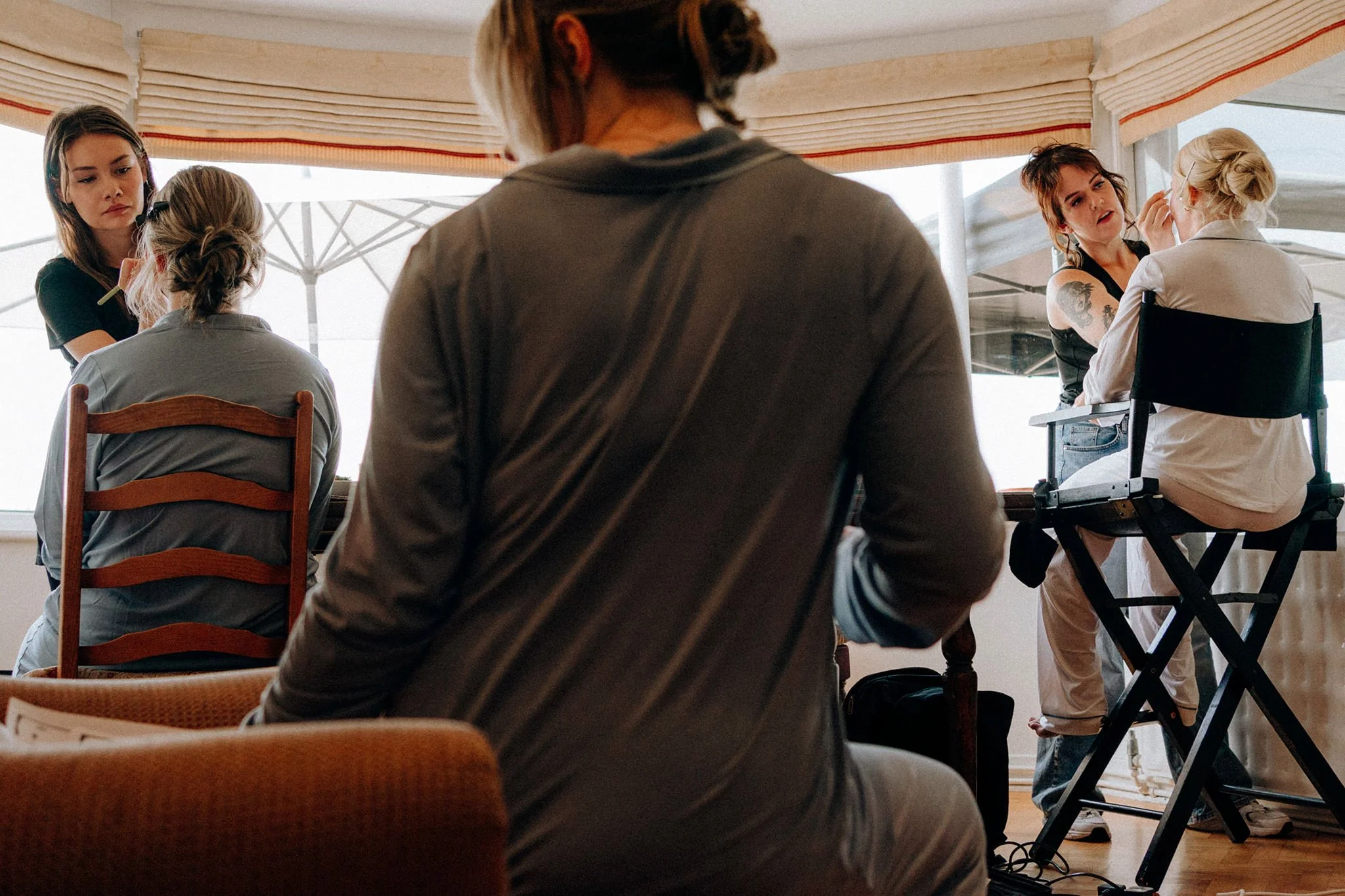 bride getting ready at home with bridesmaids