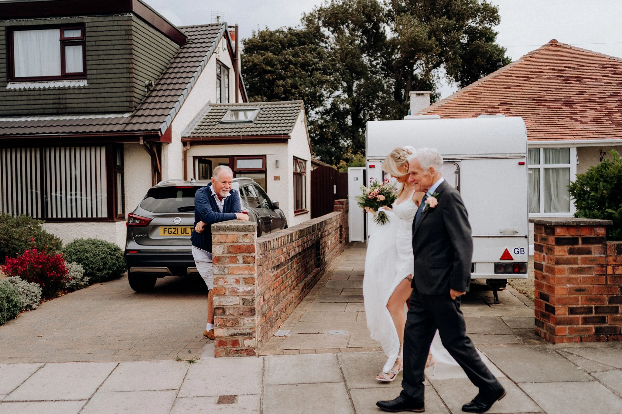 bride and grandad walk to church wallasey