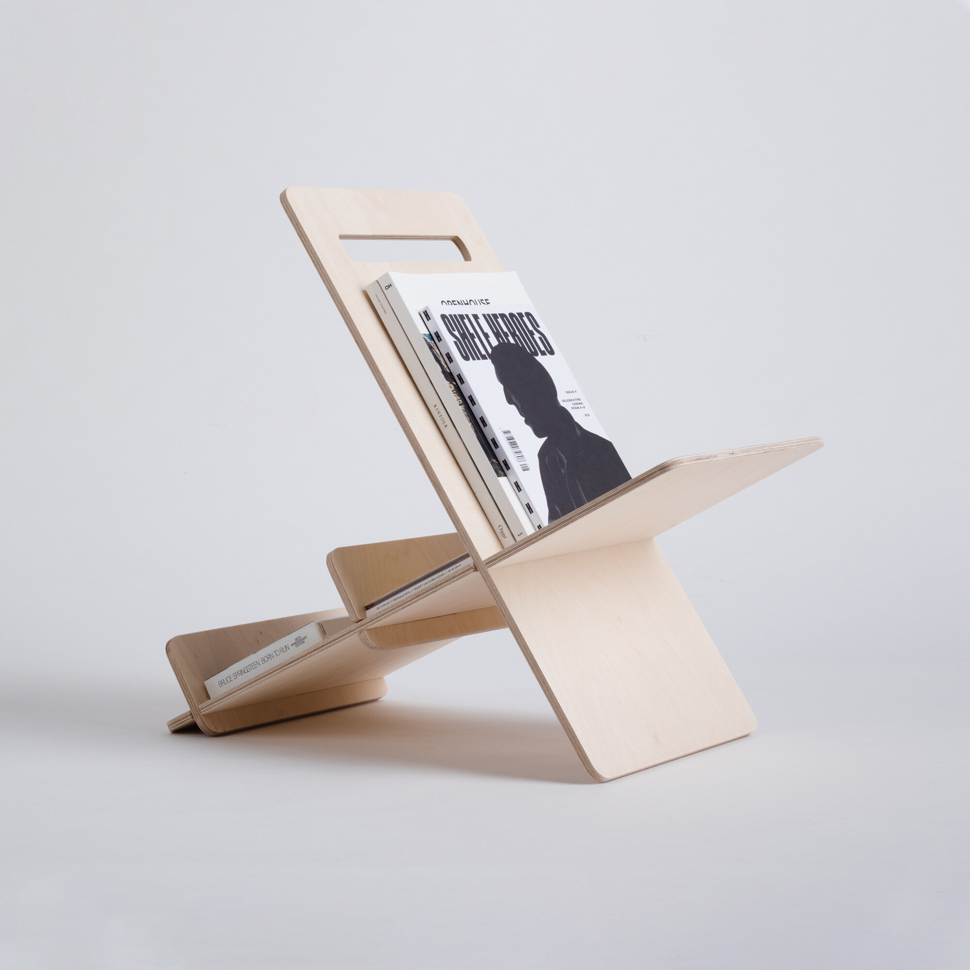 Versatile magazine rack with handle for books and magazines.