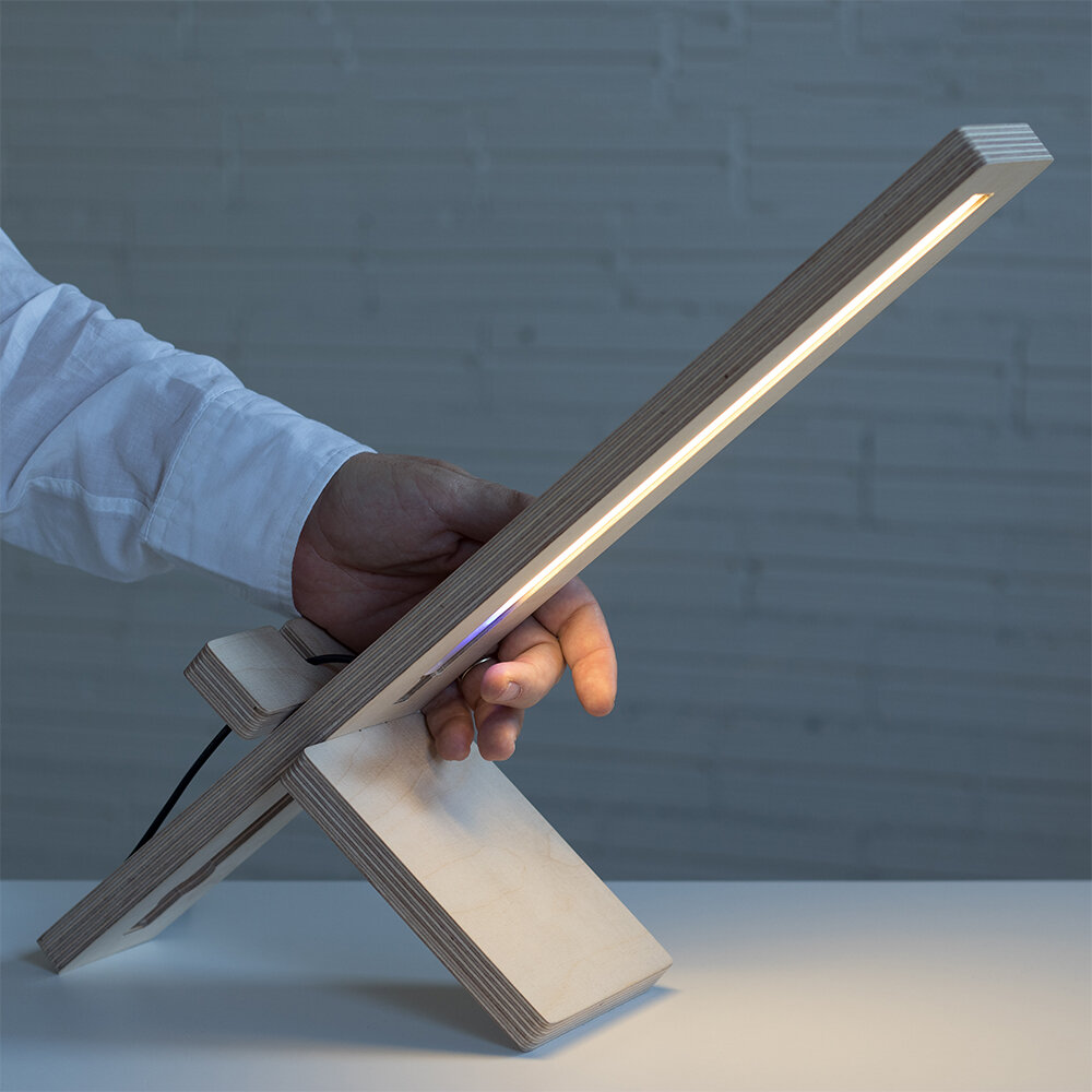 DELAMP: Dimmable LED table lamp with integrated motion sensor.