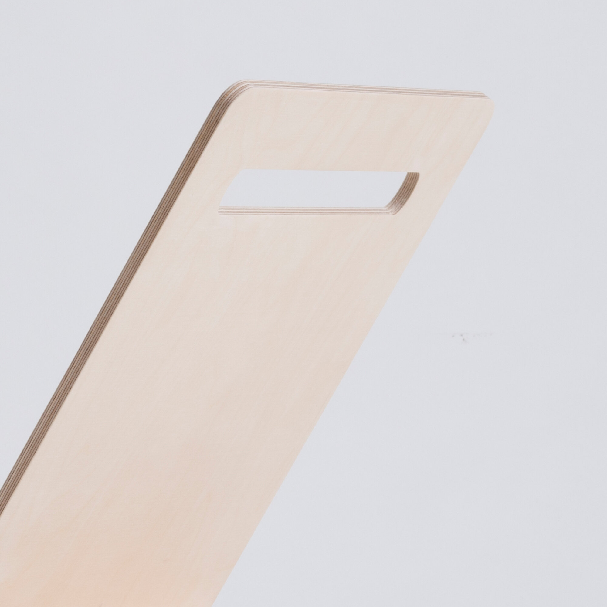Versatile magazine rack with handle for books and magazines.