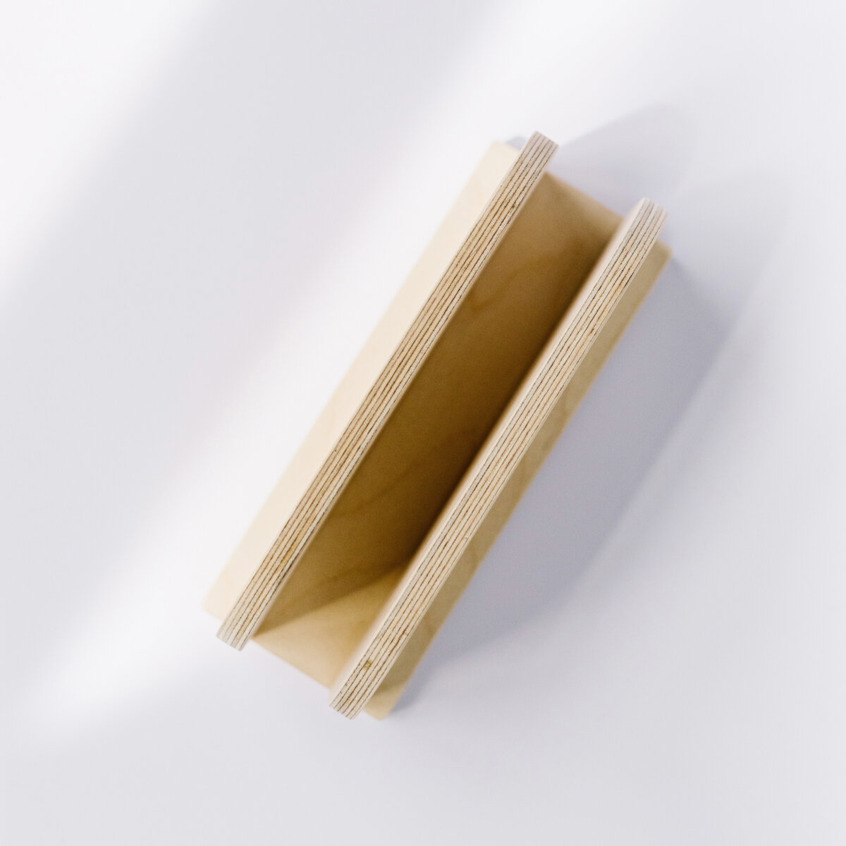 DEREST: Vertical laptop stand, charges while stored.