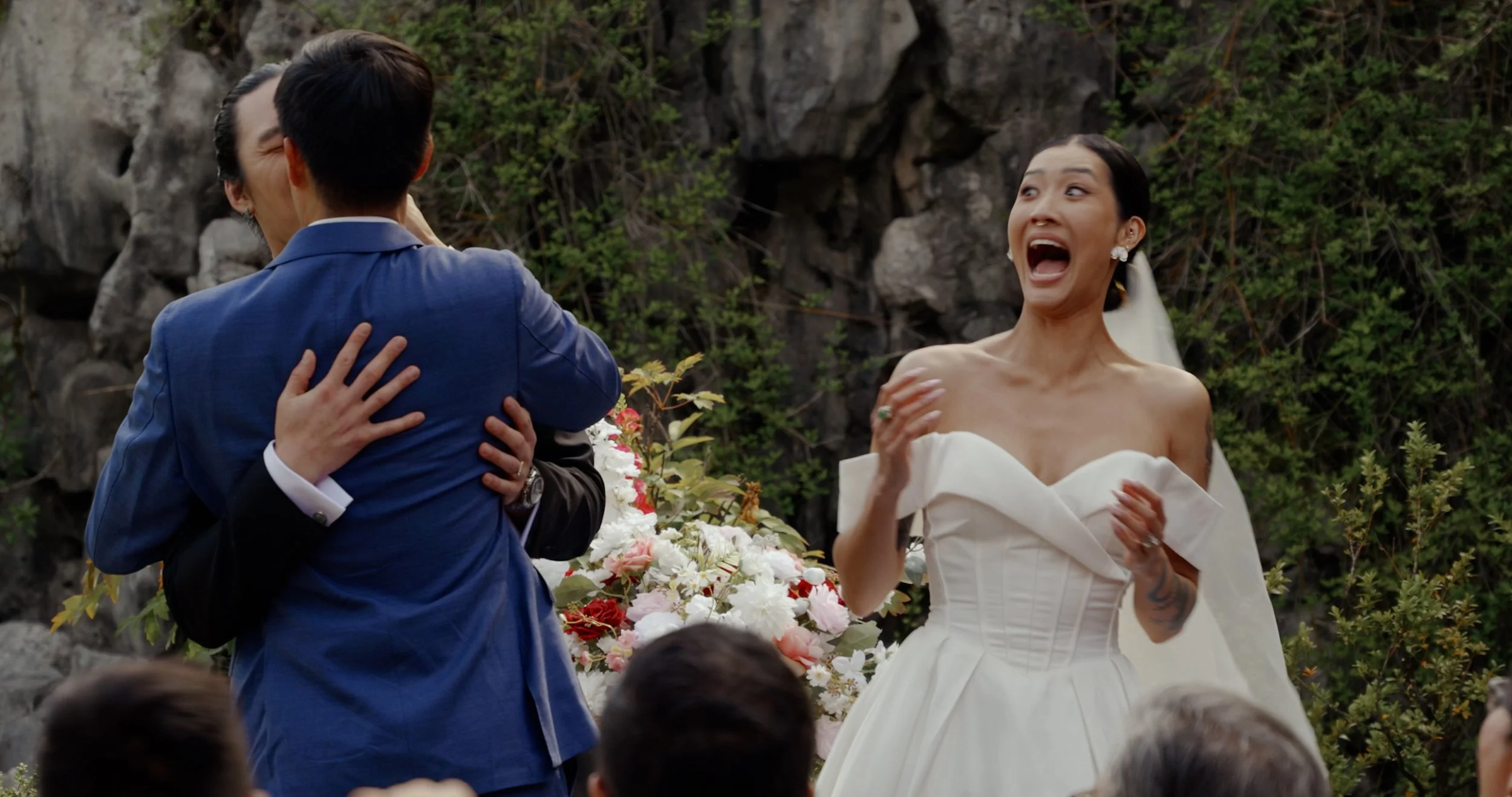 A brides' brother kissing the groom from a Vancouver Wedding Video - Dr. Sun Yat Sen Garden Wedding