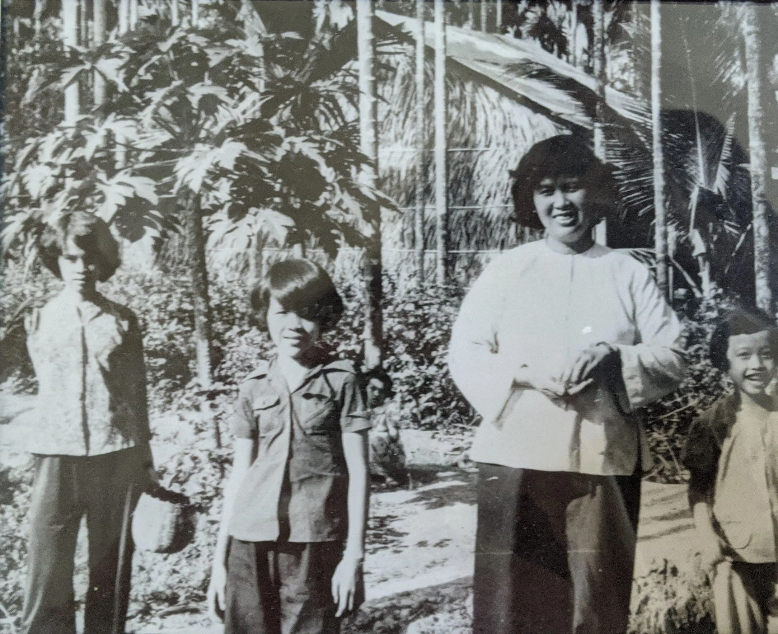 1980 An Phu Dong - My mother and I with our house in the back.