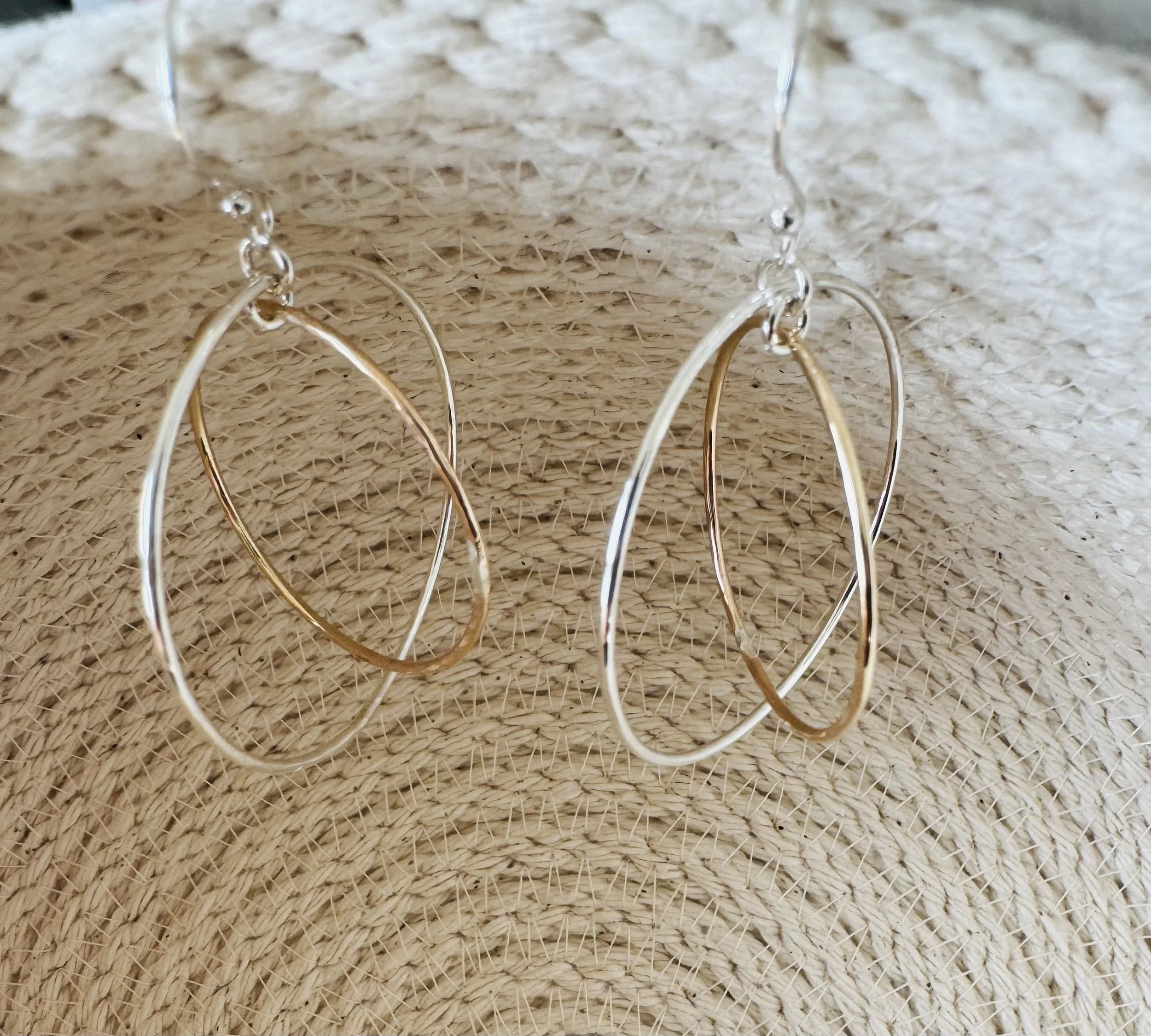 Mixed metal orbit hoops.