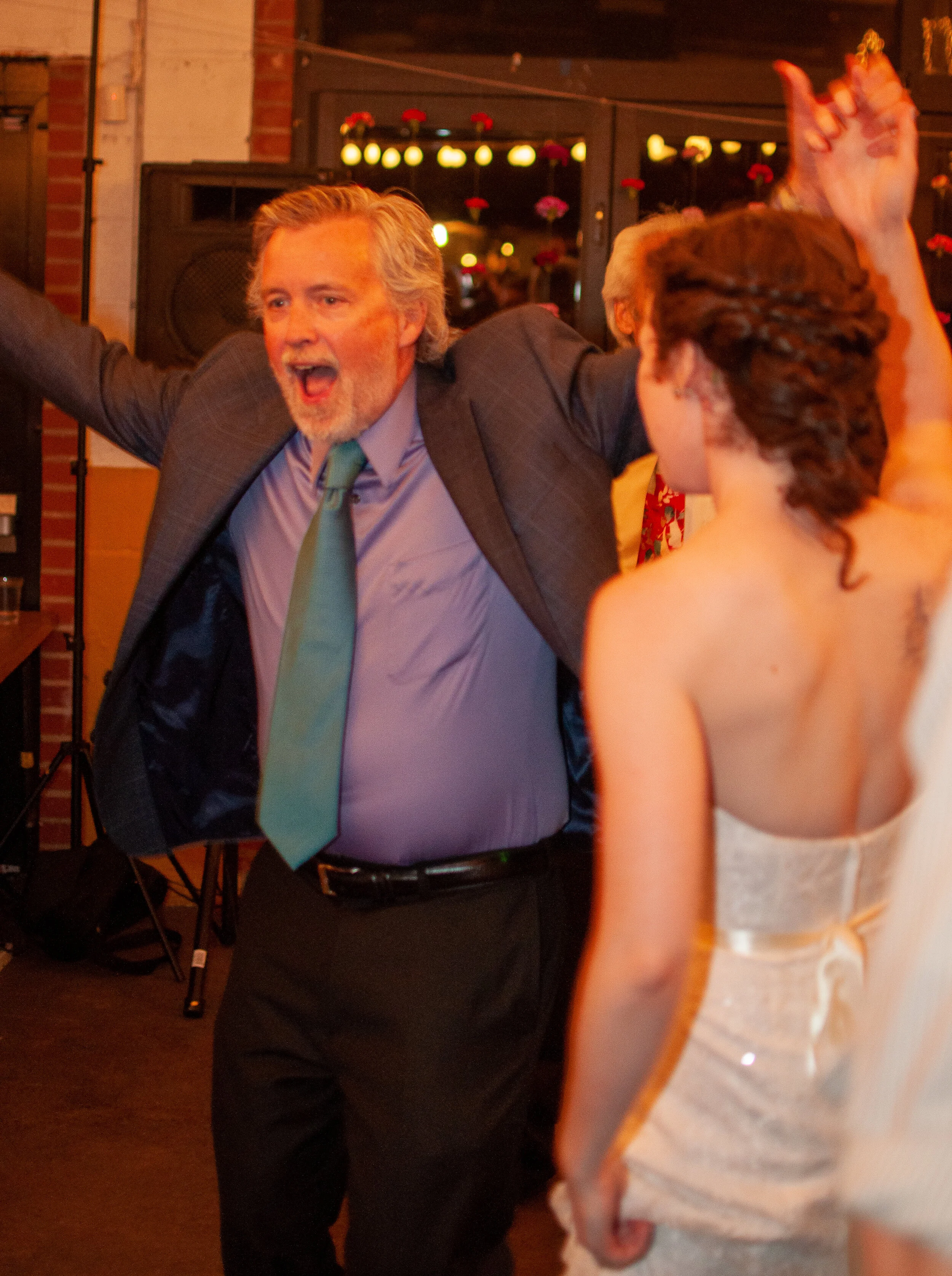 Father, dancing with daughter on wedding day.