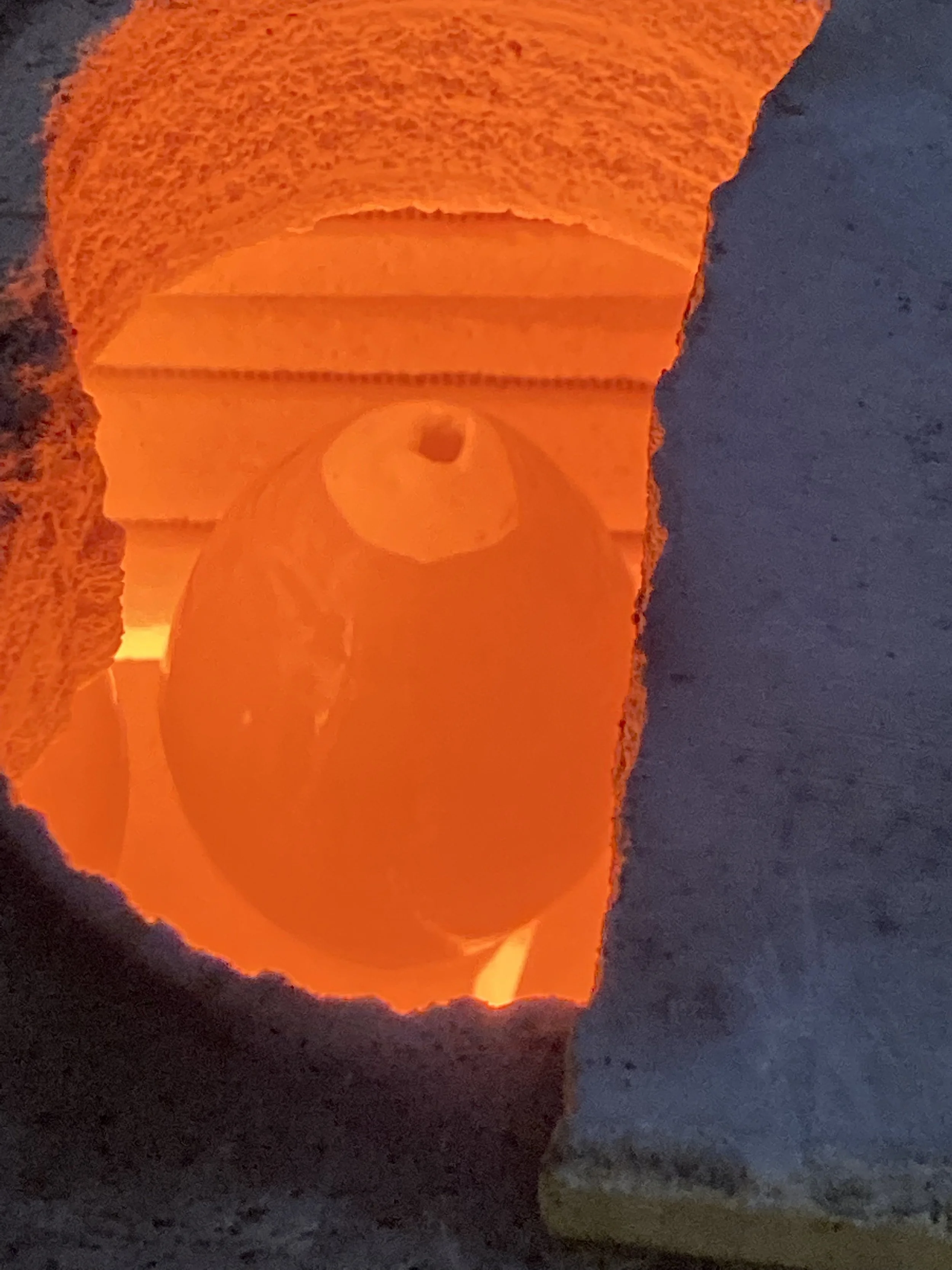 Raku workshop! A kiln glowing red as its opened to remove the hot pottery