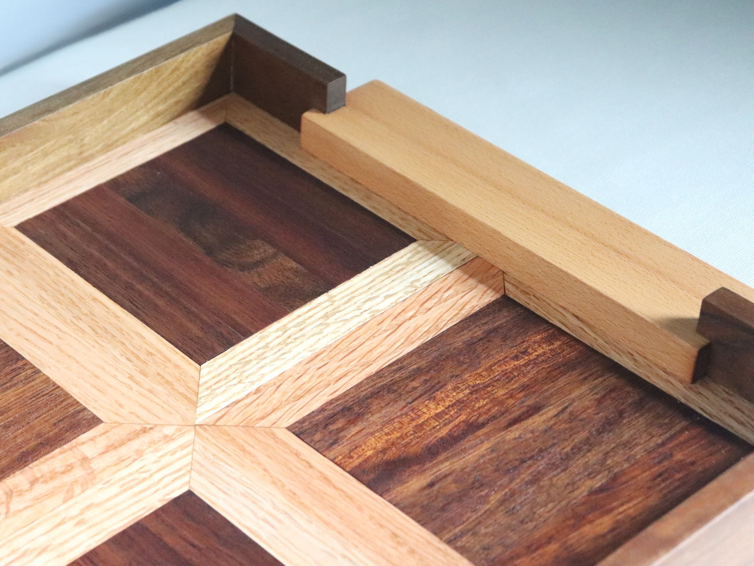 Limited edition serving tray made from reclaimed teak and oak featuring notched maple handles
