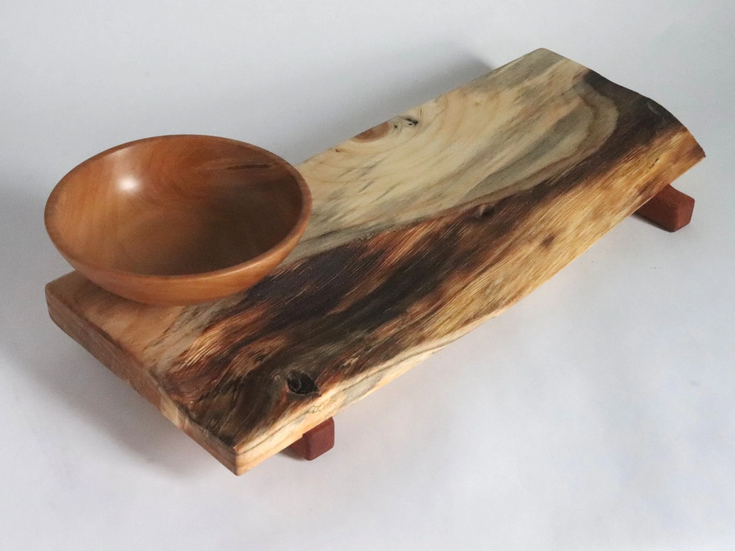 Handcrafted spalted spruce serving tray with pear wood bowl, showing natural live edge and gray spalting streaks, sapele mahogany rail feet