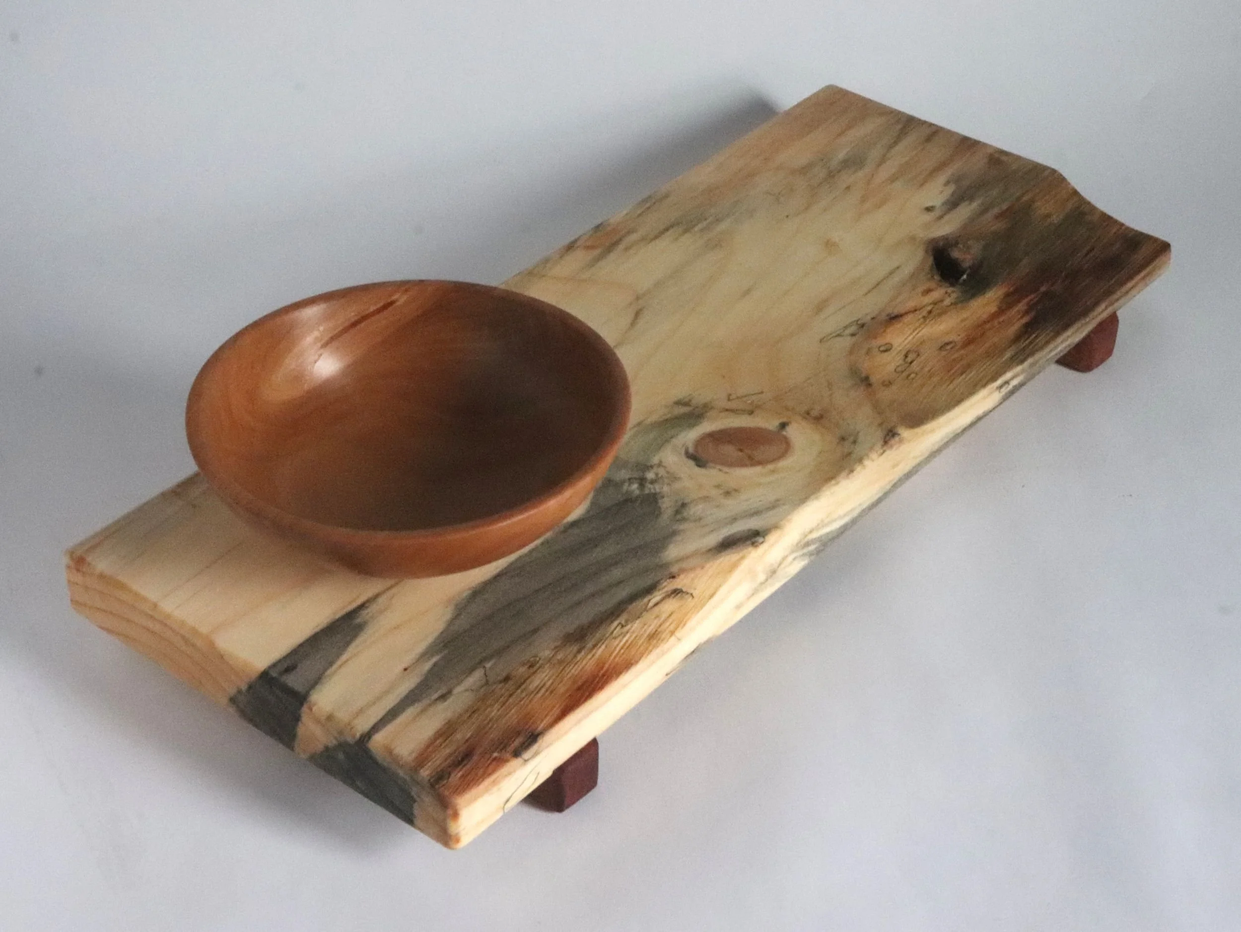 Handcrafted serving tray showing fourth live edge variation, reclaimed spalted spruce with wide grain pattern and 5-inch pear wood bowl