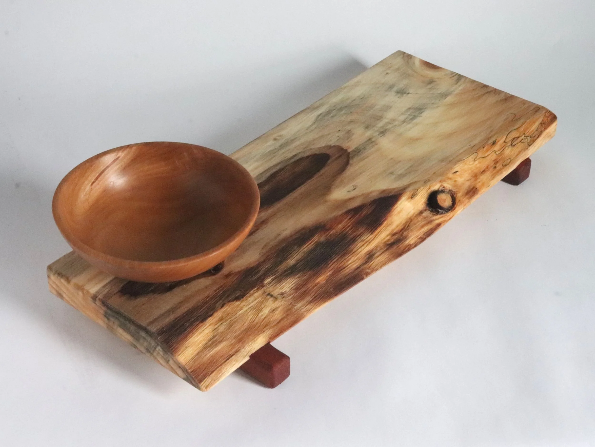 Reclaimed wood serving tray set displaying different live edge pattern, spalted spruce with distinctive grain rings and pear dipping bowl