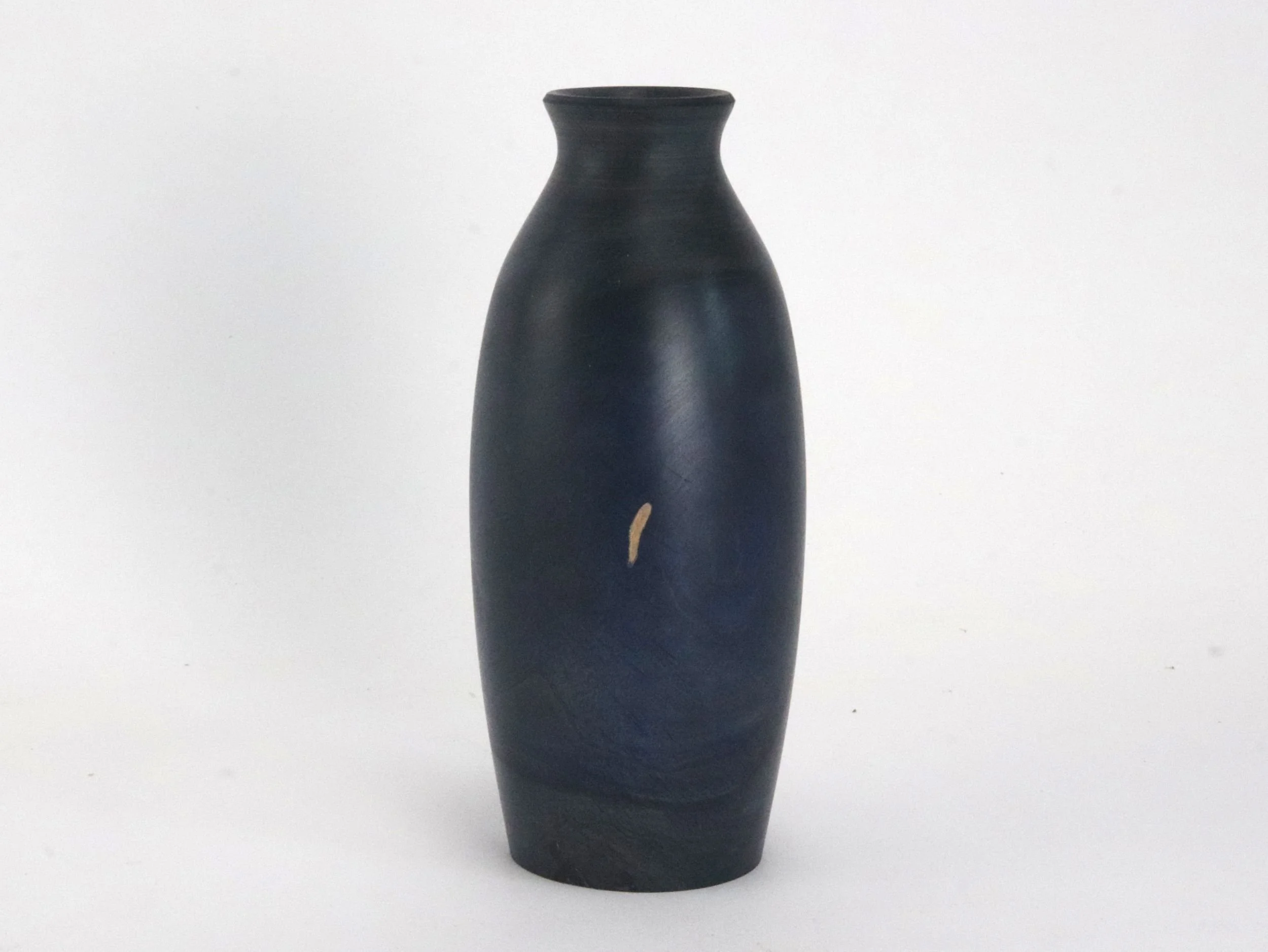 One of a kind maple vase displaying wood grain bleeding through navy blue spirit stain finish