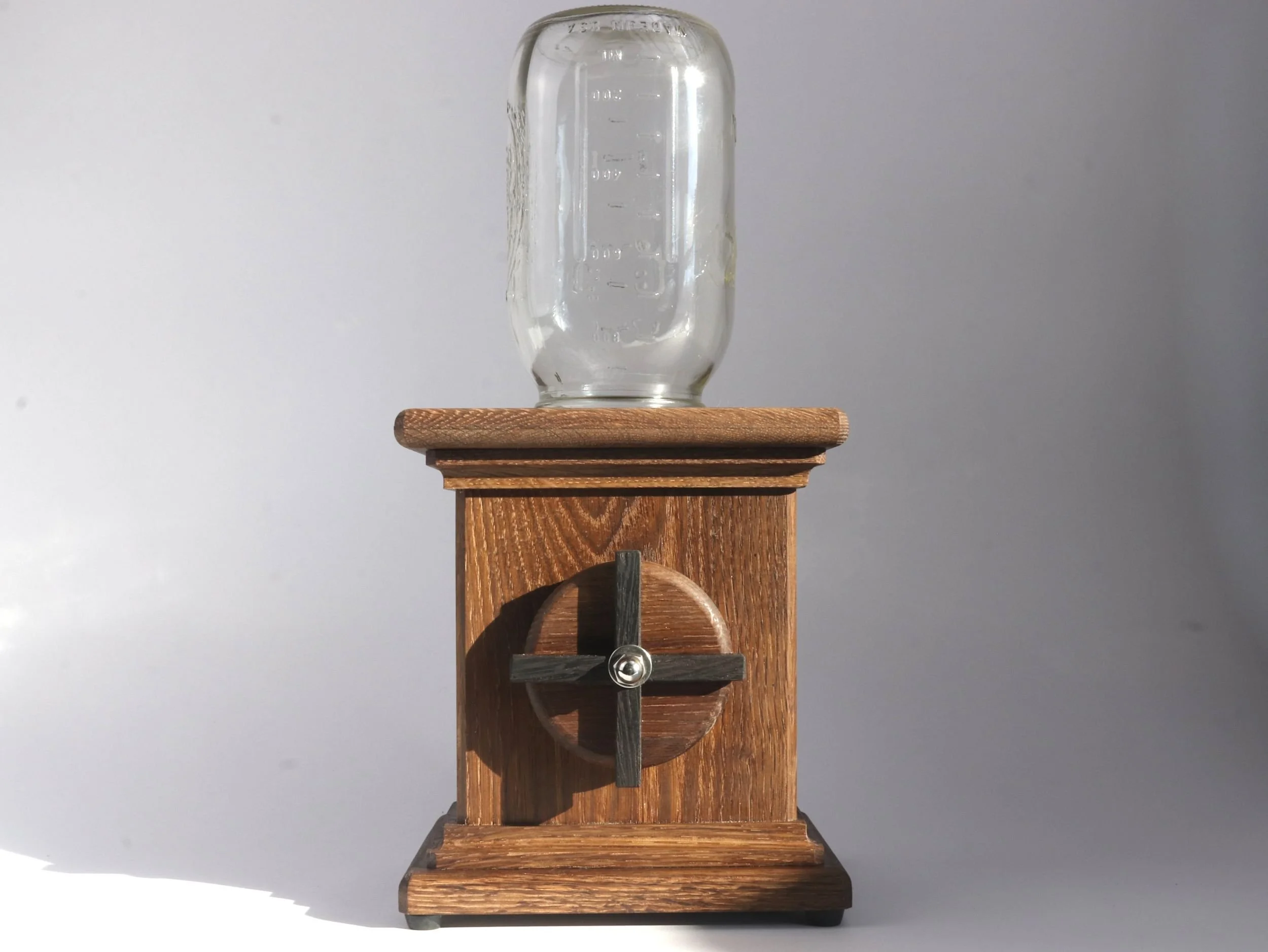 Fumed oak candy dispenser with wenge X inlay on hand crank and 4 cup glass ball jar