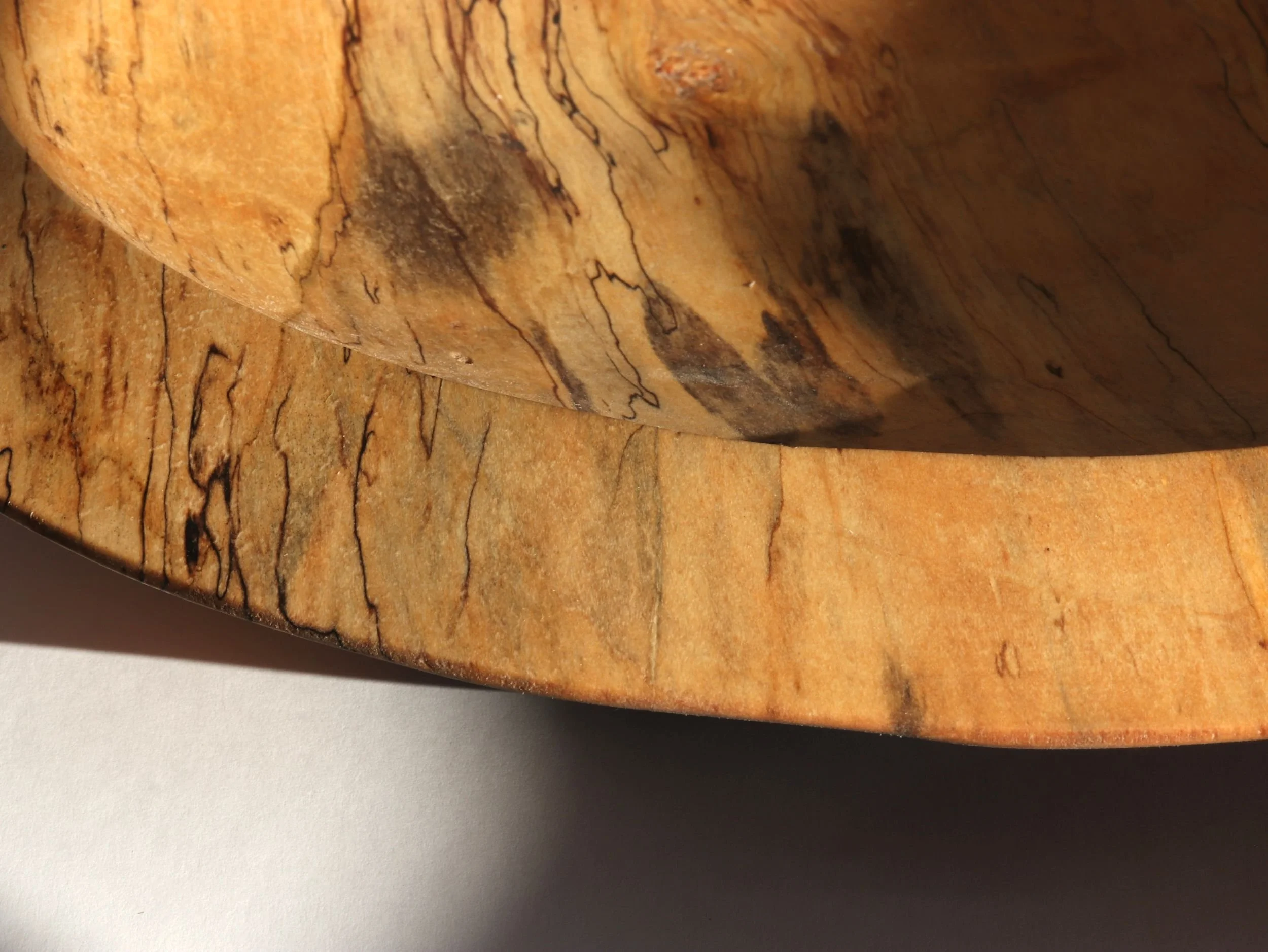 close up of rim on spalted maple bowl