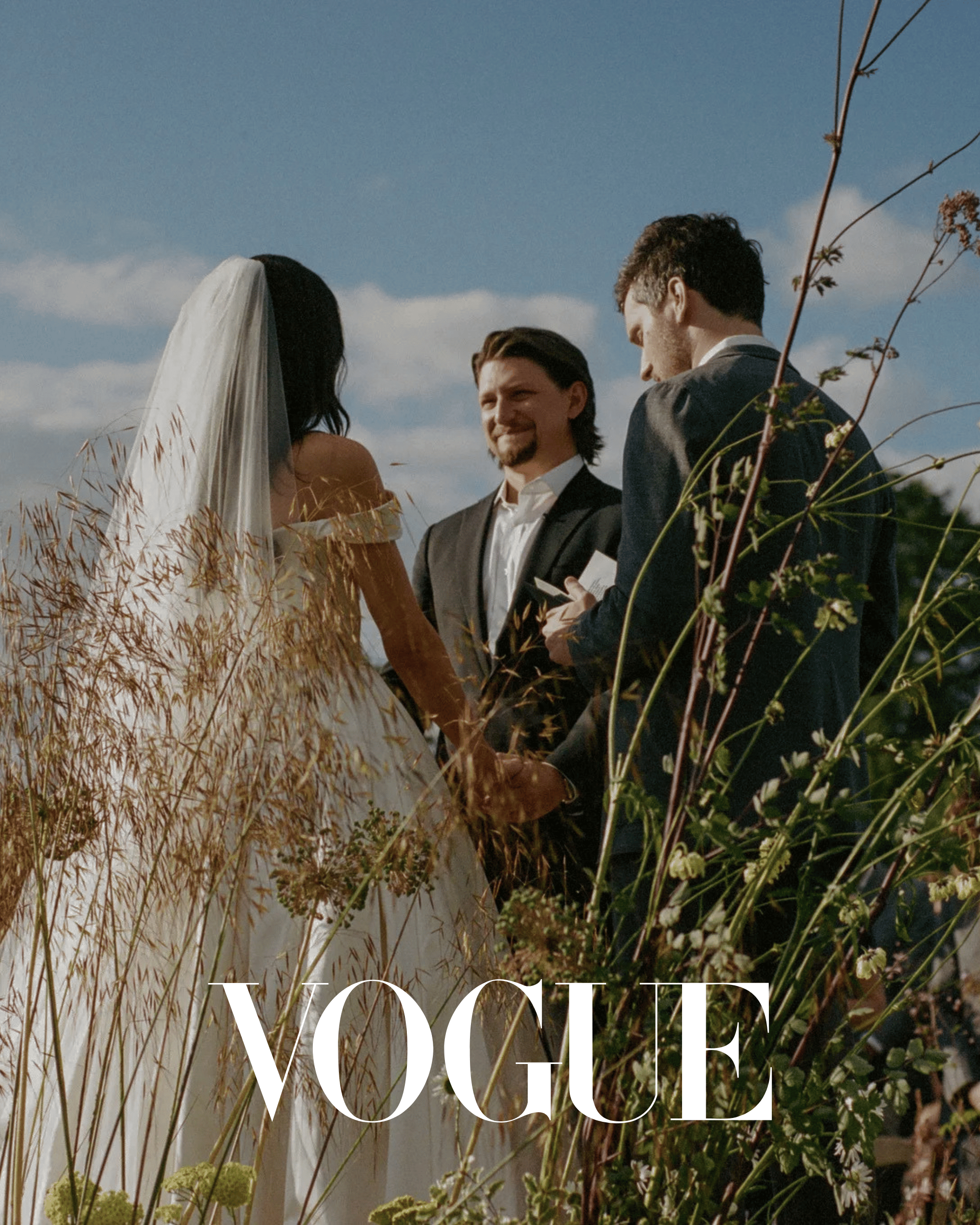 Romantic outdoor wedding ceremony in an English country garden with bride and groom surrounded by natural greenery