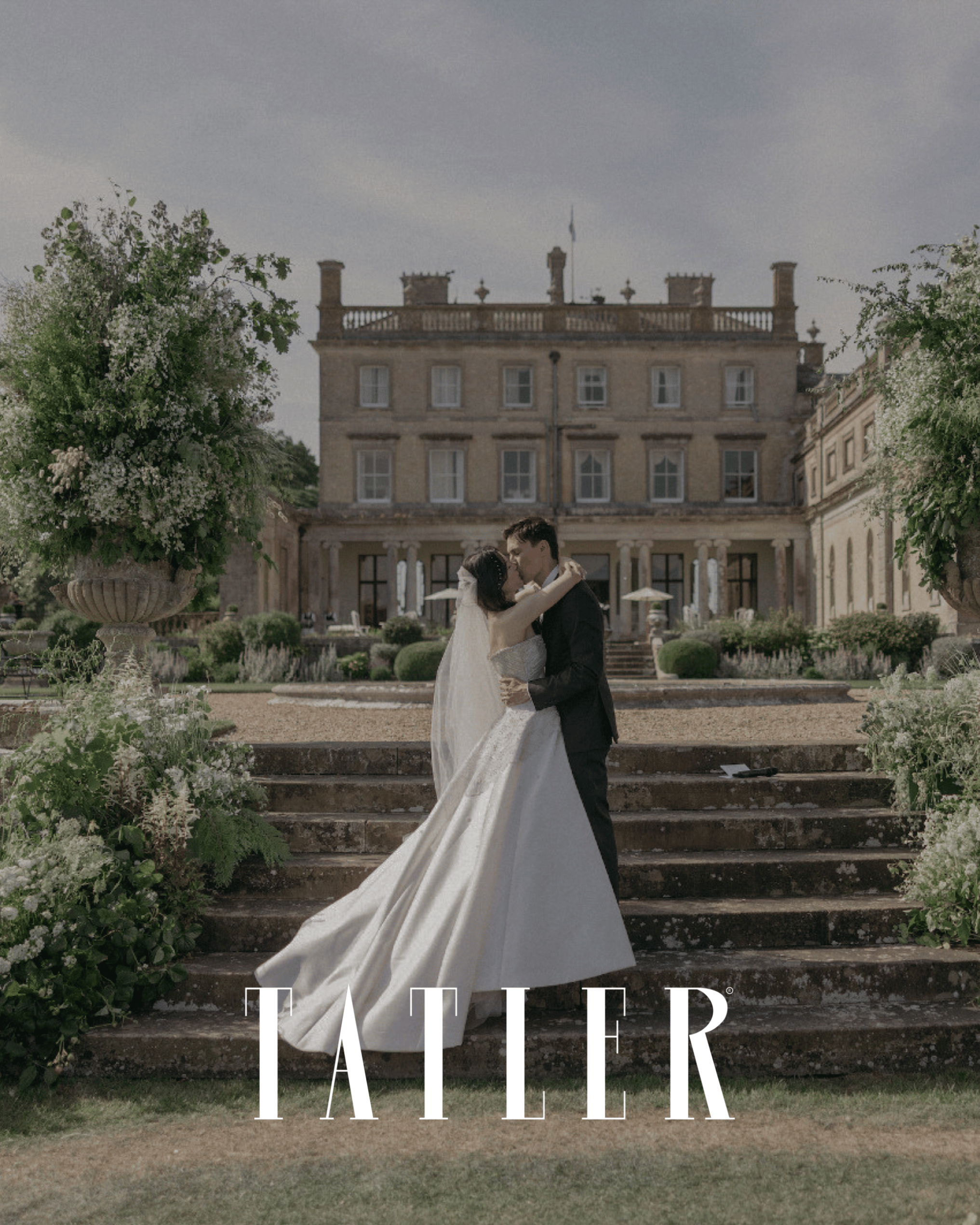 Romantic English country house wedding with bride and groom outside a historic manor house, featured in Tatler